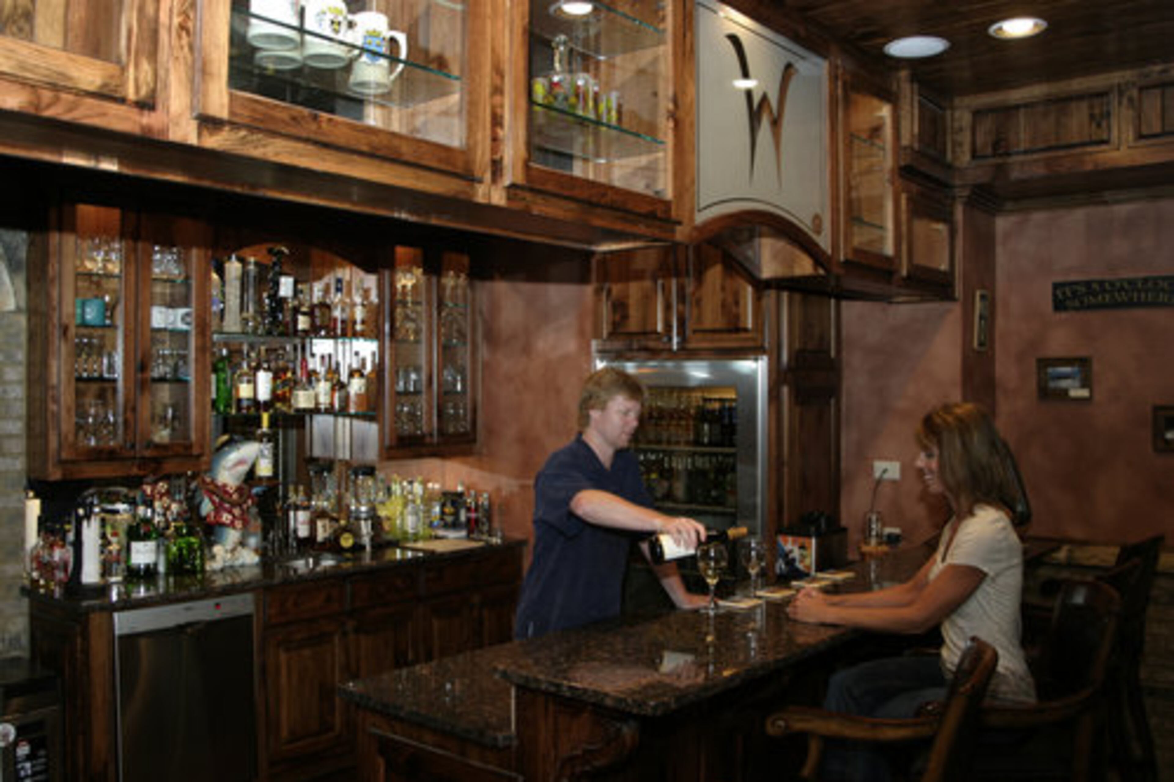 The recreation area is also equipped with an elaborate wet bar and a brick wine cellar.