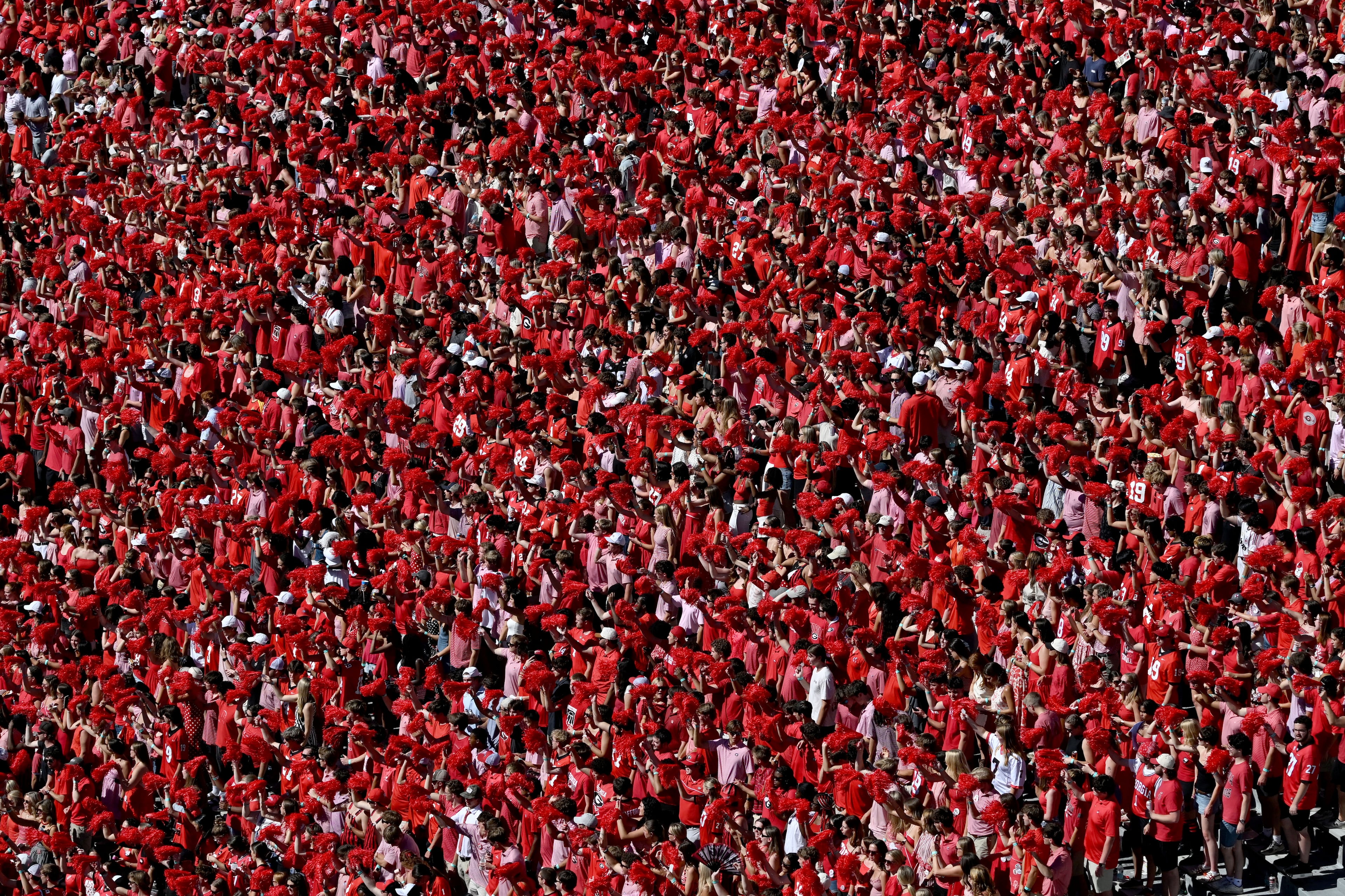Georgia fans cheer during a flyover before an NCAA college football game against Oklahoma at Sanford Stadium on Saturday, Sept. 26, 2026, in Athens, Ga. (Hyosub Shin/AJC)