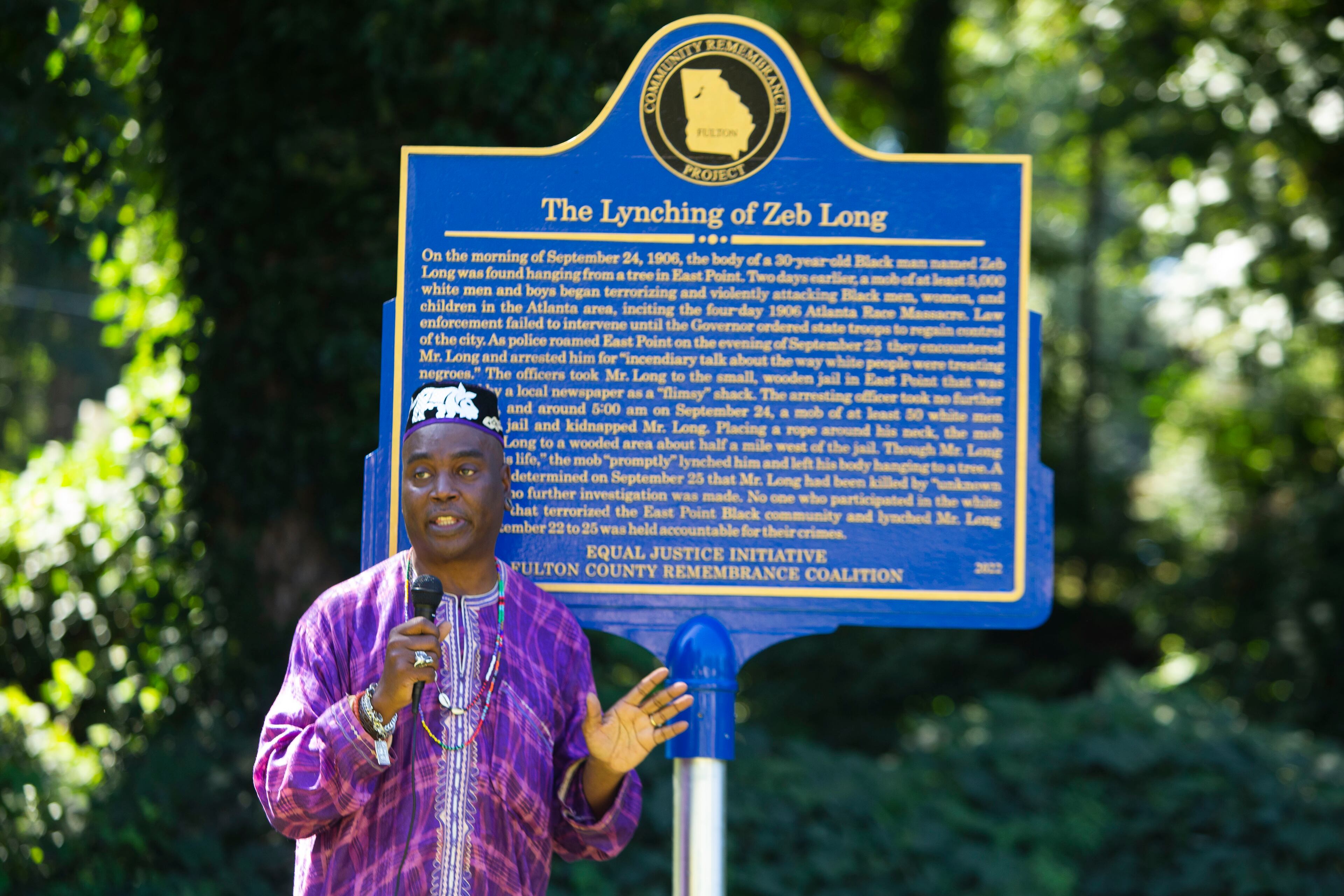 Christopher Swain, public art coordinator for East Point, speaks during the dedication of a historical marker for Zeb Long, a lynching victim from the 1906 Atlanta Race Massacre, on Saturday, September 24, 2022, at Sumner Park. CHRISTINA MATACOTTA FOR THE ATLANTA JOURNAL-CONSTITUTION
