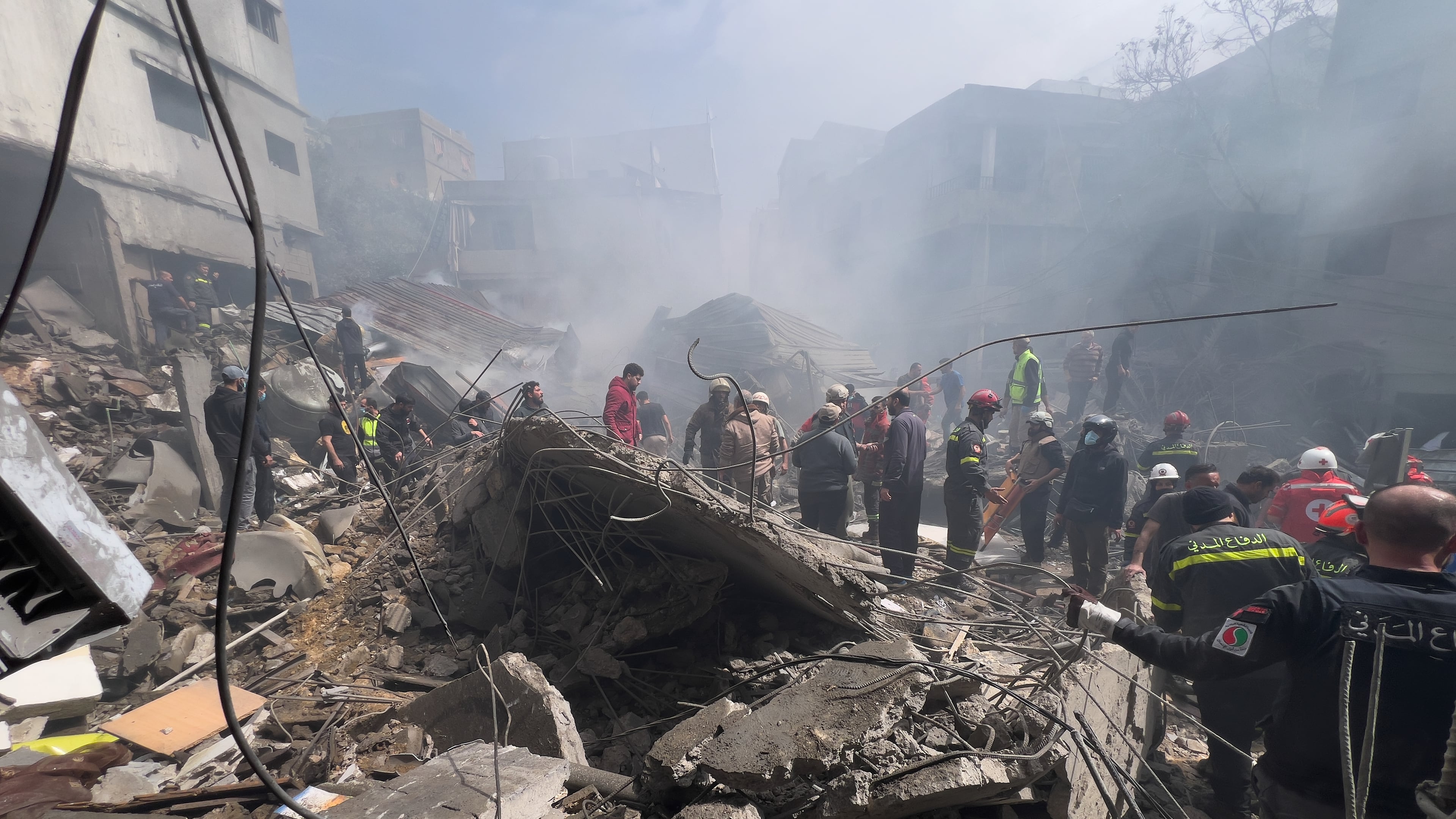 Rescue workers search for victims at the site of an Israeli airstrike that hit a crowded neighbourhood south of Beirut, Lebanon, Sunday, April 5, 2026. (AP Photo/Hussein Malla)