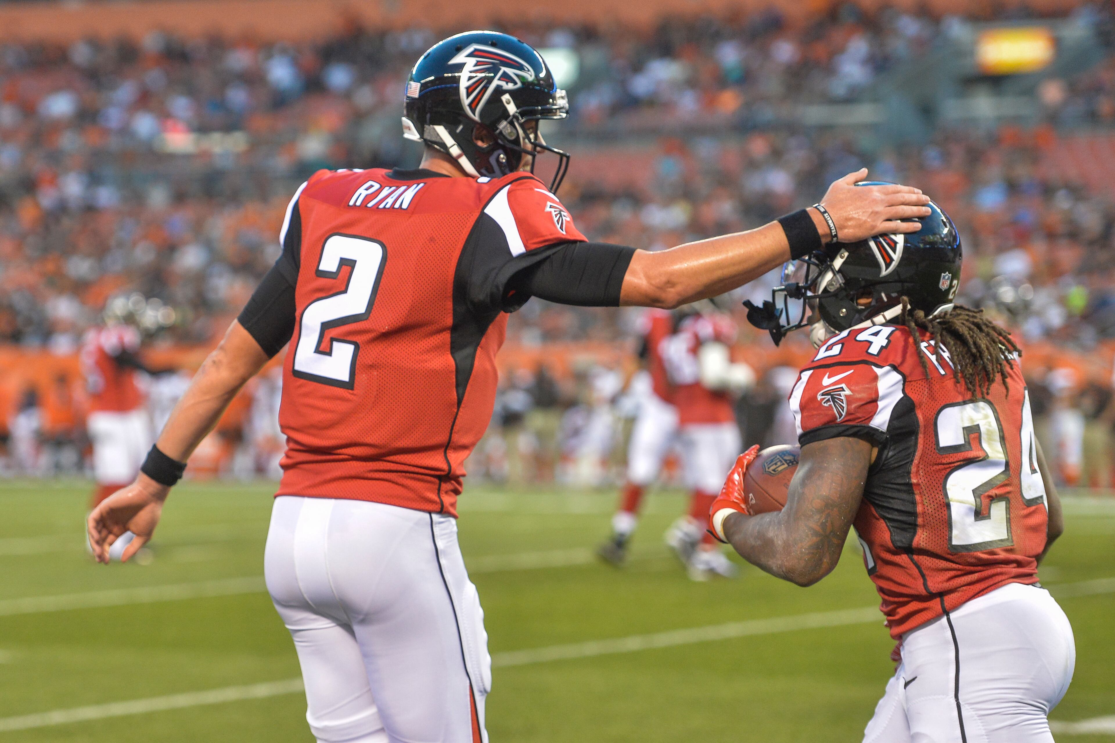 Atlanta Falcons quarterback Matt Ryan (2) celebrates after running back Devonta Freeman (24) scores a touchdown in the first half of an NFL preseason football game against the Cleveland Browns, Thursday, Aug. 18, 2016, in Cleveland. (AP Photo/David Richard)