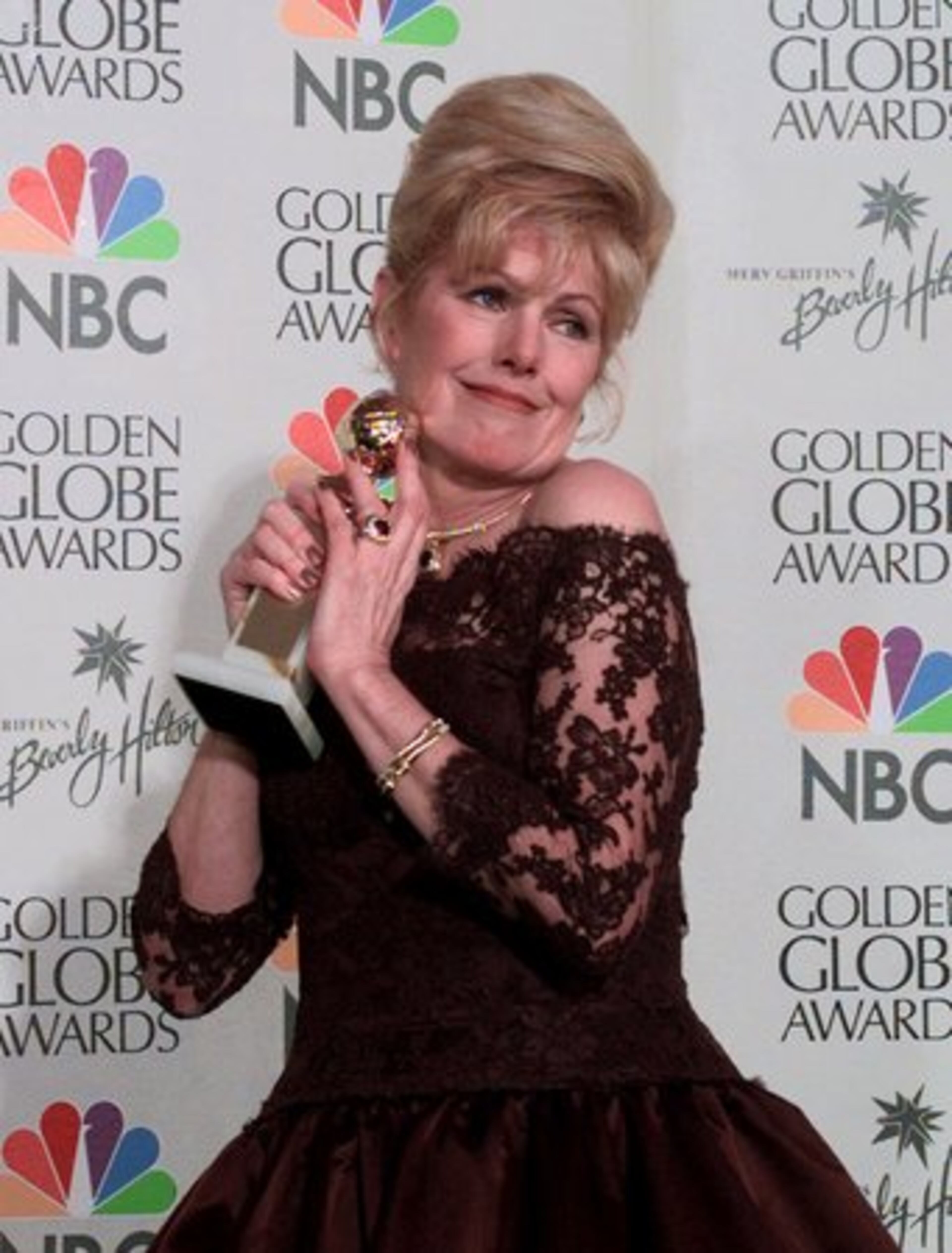 In this Jan. 24, 1999 file photo, Redgrave holds her award for Best Supporting Actress in a Motion Picture for her role in "Gods & Monsters" during the 56th annual Golden Globes in Beverly Hills, Calif.