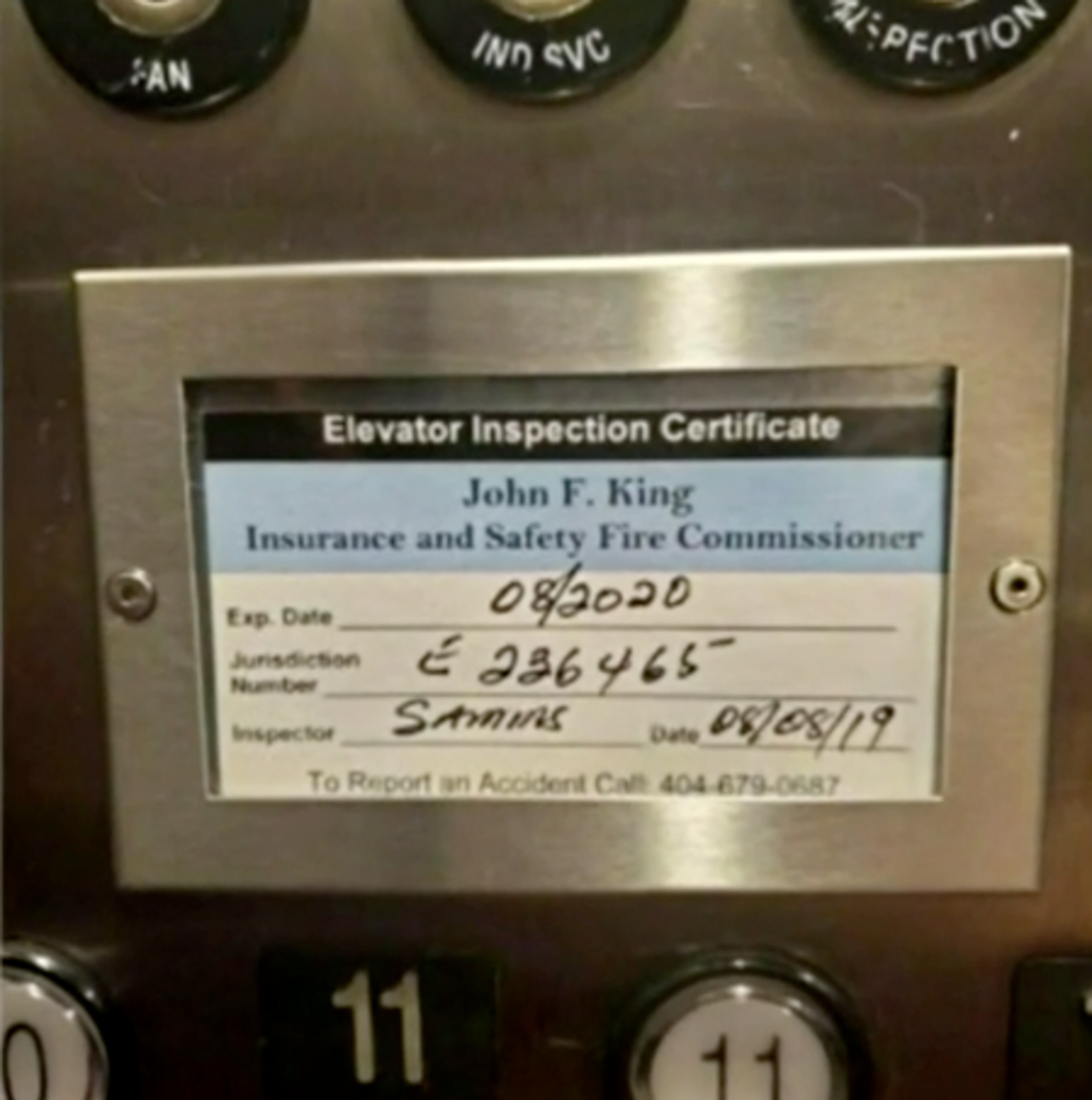 A photo from inside the elevator shows that it had not been inspected since August 2019.