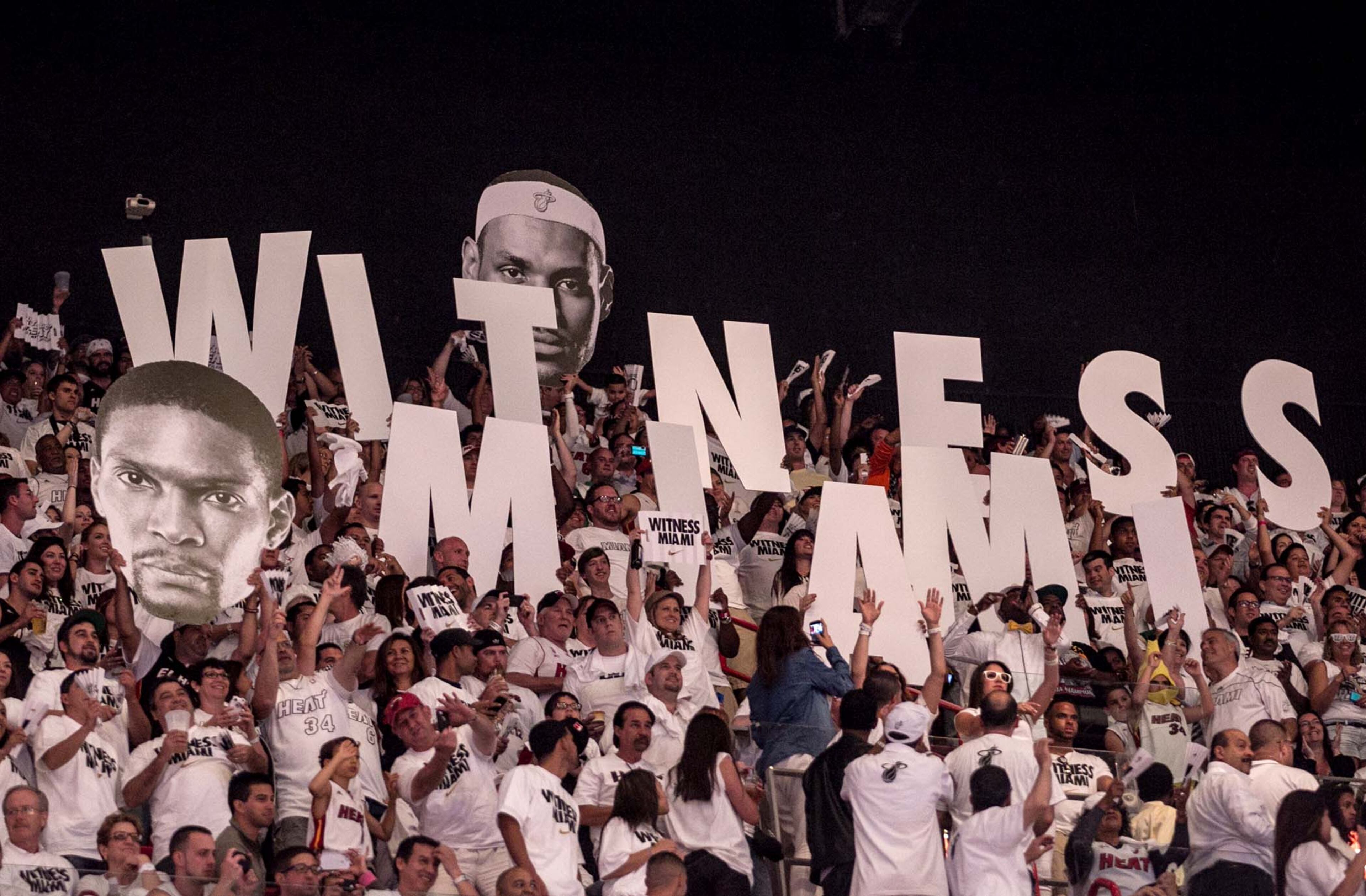 Fans jump around during a timeout at AmericanAirlines Arena on April 21, 2013. (Allen Eyestone/The Palm Beach Post)