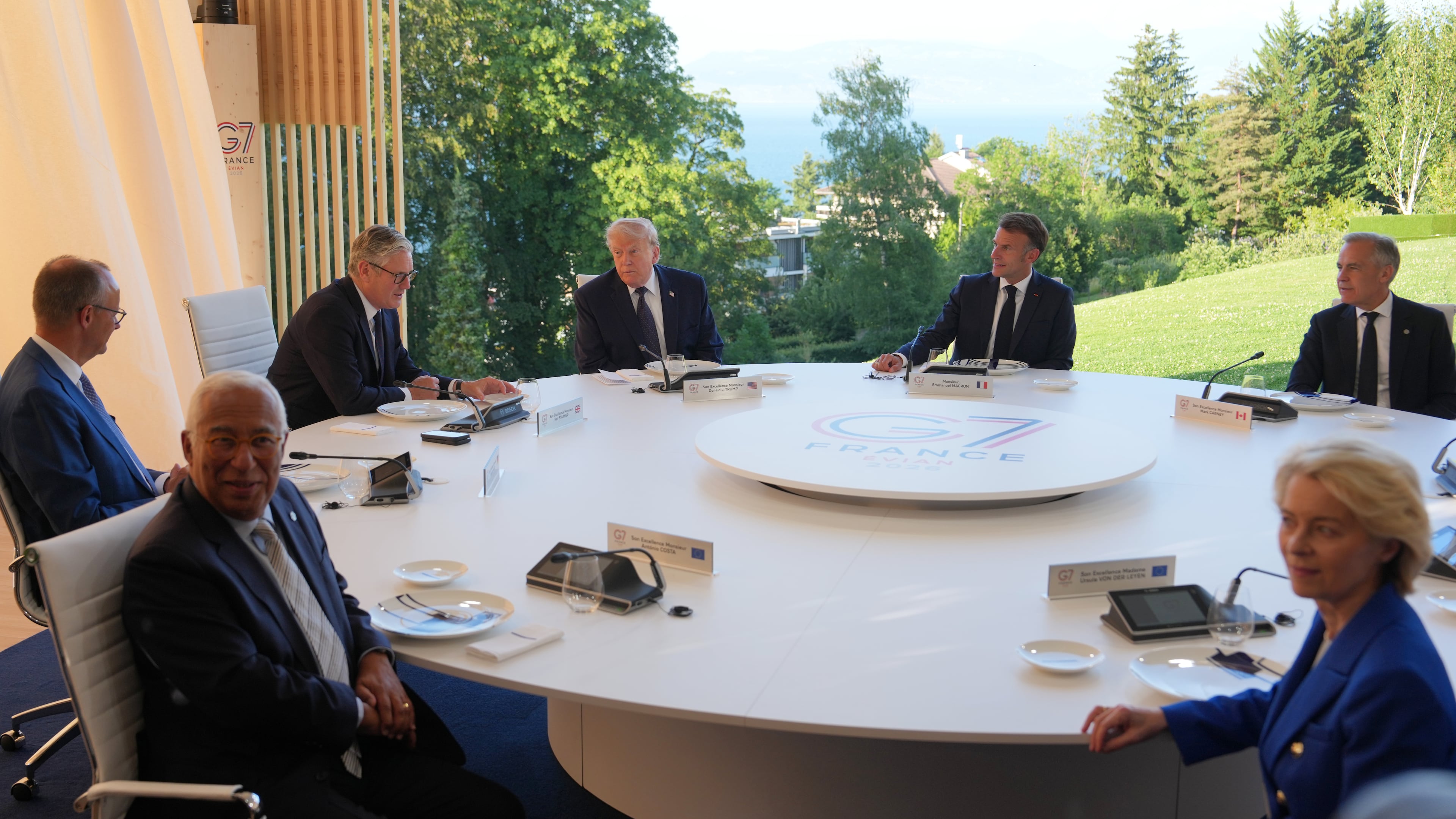 FILE - U.S. President Donald Trump and France's President Emmanuel Macron meet at the G7 summit, June 15, 2026, in Evian-les-Bains, France, with European Commission President Ursula von der Leyen, right, European Council President Antonio Costa, front left, Germany's Chancellor Friedrich Merz, Britain's Prime Minister Keir Starmer and Canada's Prime Minister Mark Carney. (AP Photo/Julia Demaree Nikhinson, File)