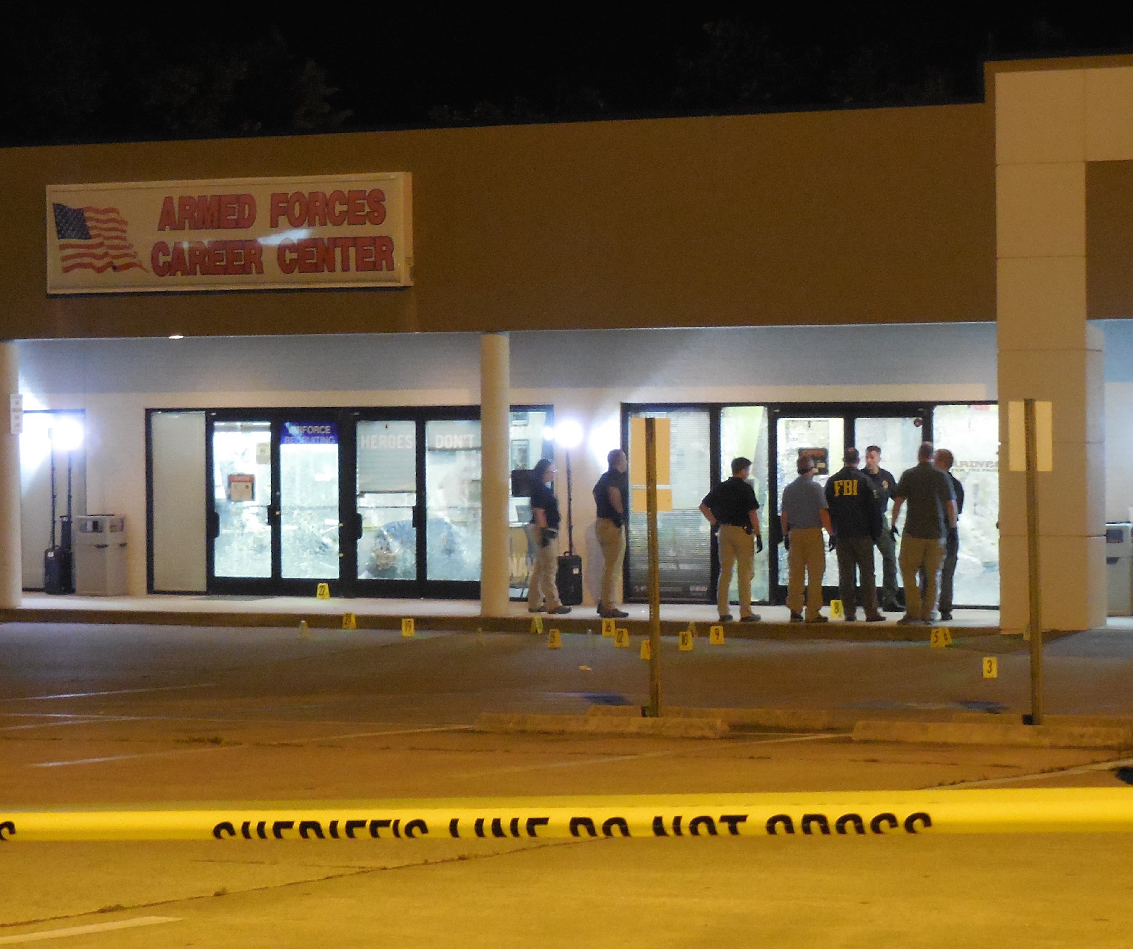 Investigators worked the scene into the night. Photo: Jennifer Brett