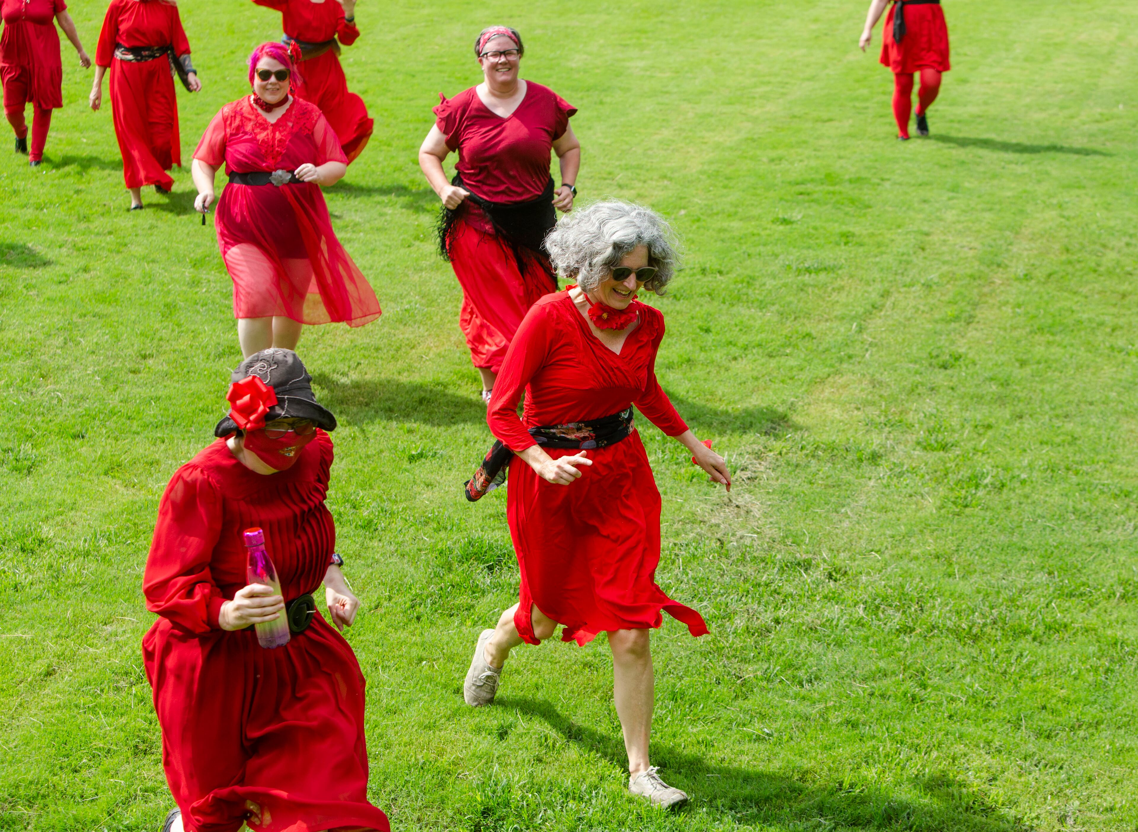 Kate Bush fans "running up that hill" after a group dance performance to celebrate the seventh annual international "Most Wuthering Heights Day Ever," on Saturday, July 30, 2022, in Candler Park in Atlanta. The event celebrates Kate Bush's 1978 song "Wuthering Heights" with events in more than 40 cities around the world. CHRISTINA MATACOTTA FOR THE ATLANTA JOURNAL-CONSTITUTION