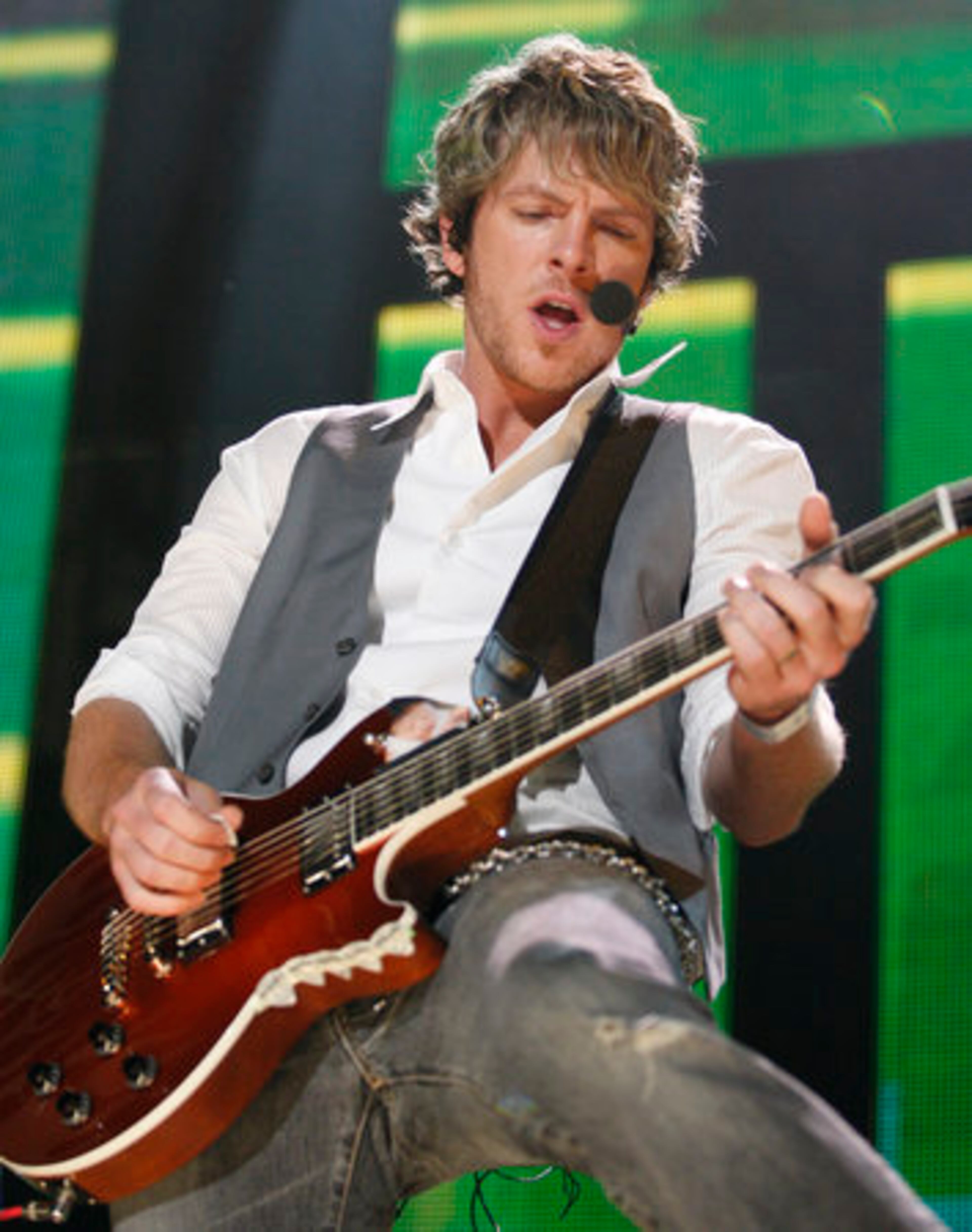 Joe Don Rooney, the guitarist for Rascal Flatts performs.