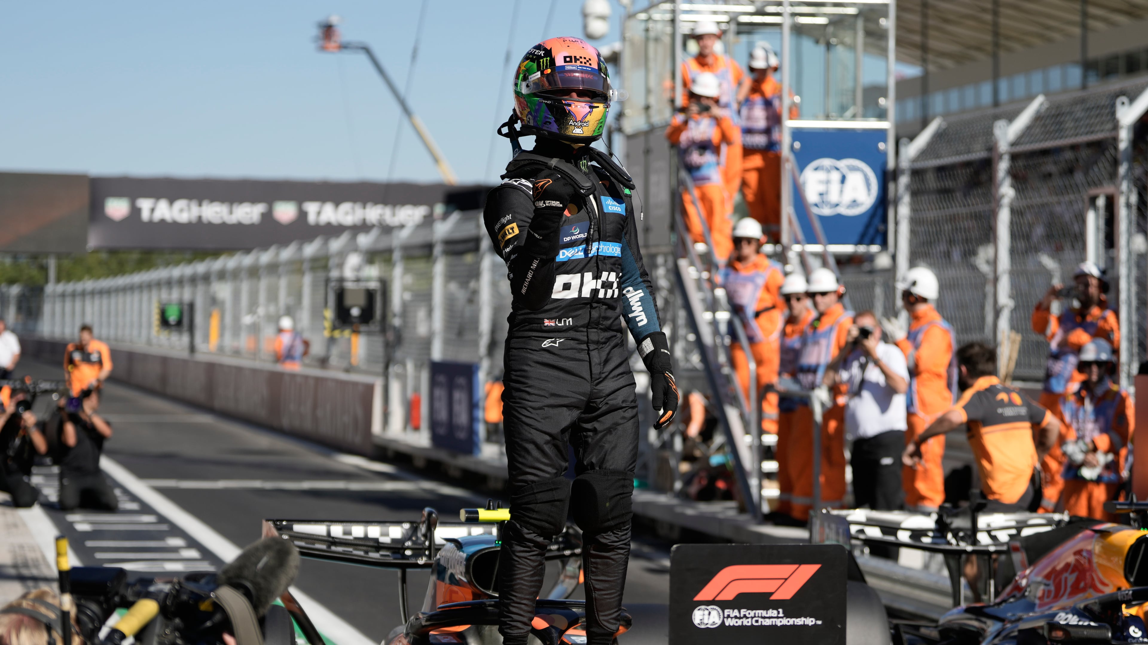 McLaren driver Lando Norris of Britain celebrates his pole position after the qualifying session for the Spanish Formula One Grand Prix in Madrid, Saturday, Sept. 12, 2026. (AP Photo/Bernat Armangue)