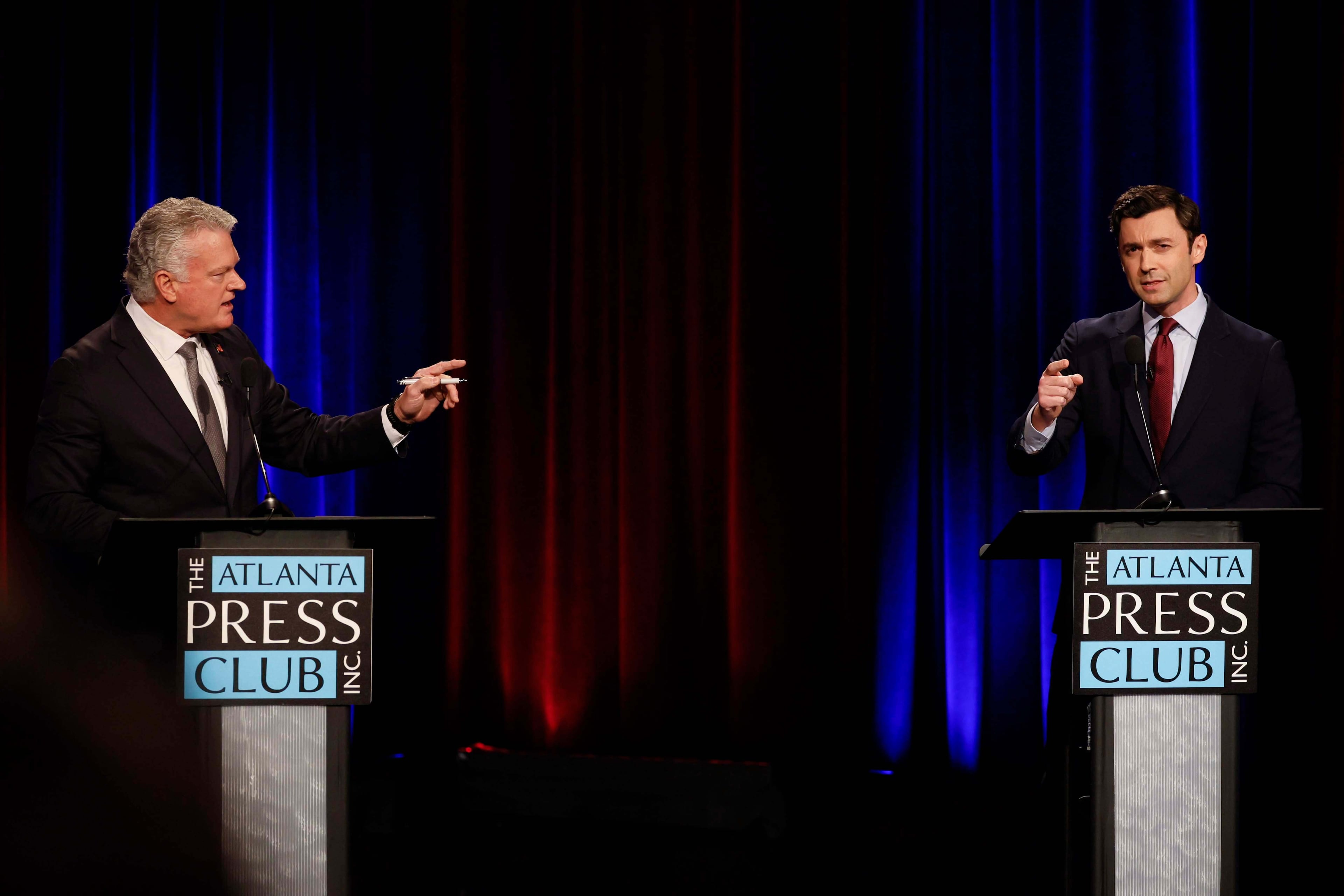 Republican U.S. Rep. Mike Collins (left) debates incumbent Democratic U.S. Sen. Jon Ossoff during the Loudermilk-Young Senate Debate Series at the Georgia Public Broadcasting studio in Atlanta on Tuesday. (Miguel Martinez/AJC)