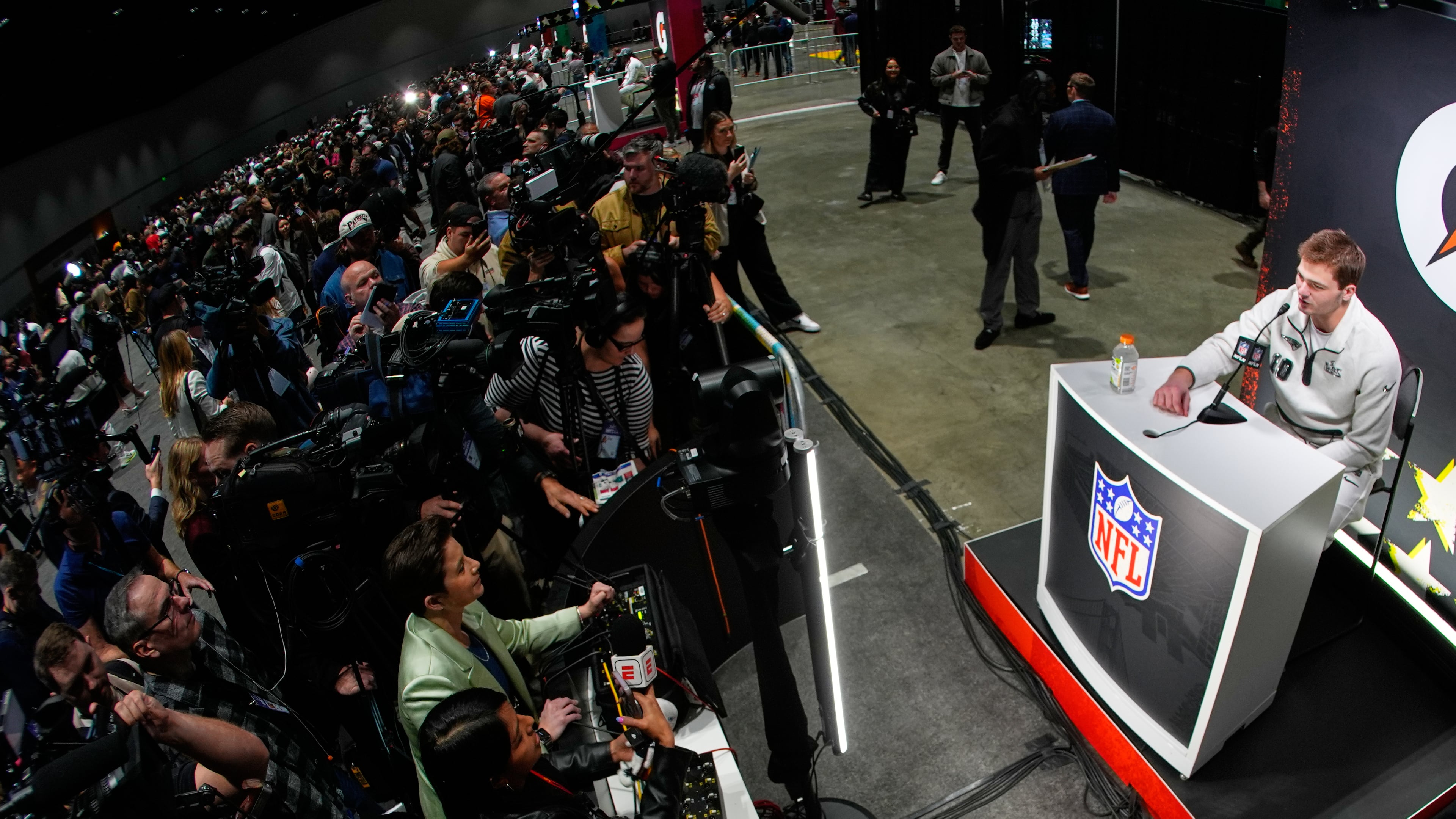 New England Patriots quarterback Drake Maye speaks during the NFL Super Bowl Opening Night, Monday, Feb. 2, 2026, in San Jose, Calif., ahead of the Super Bowl 60 football game between the Seattle Seahawks and the New England Patriots. (AP Photo/Charlie Riedel)
