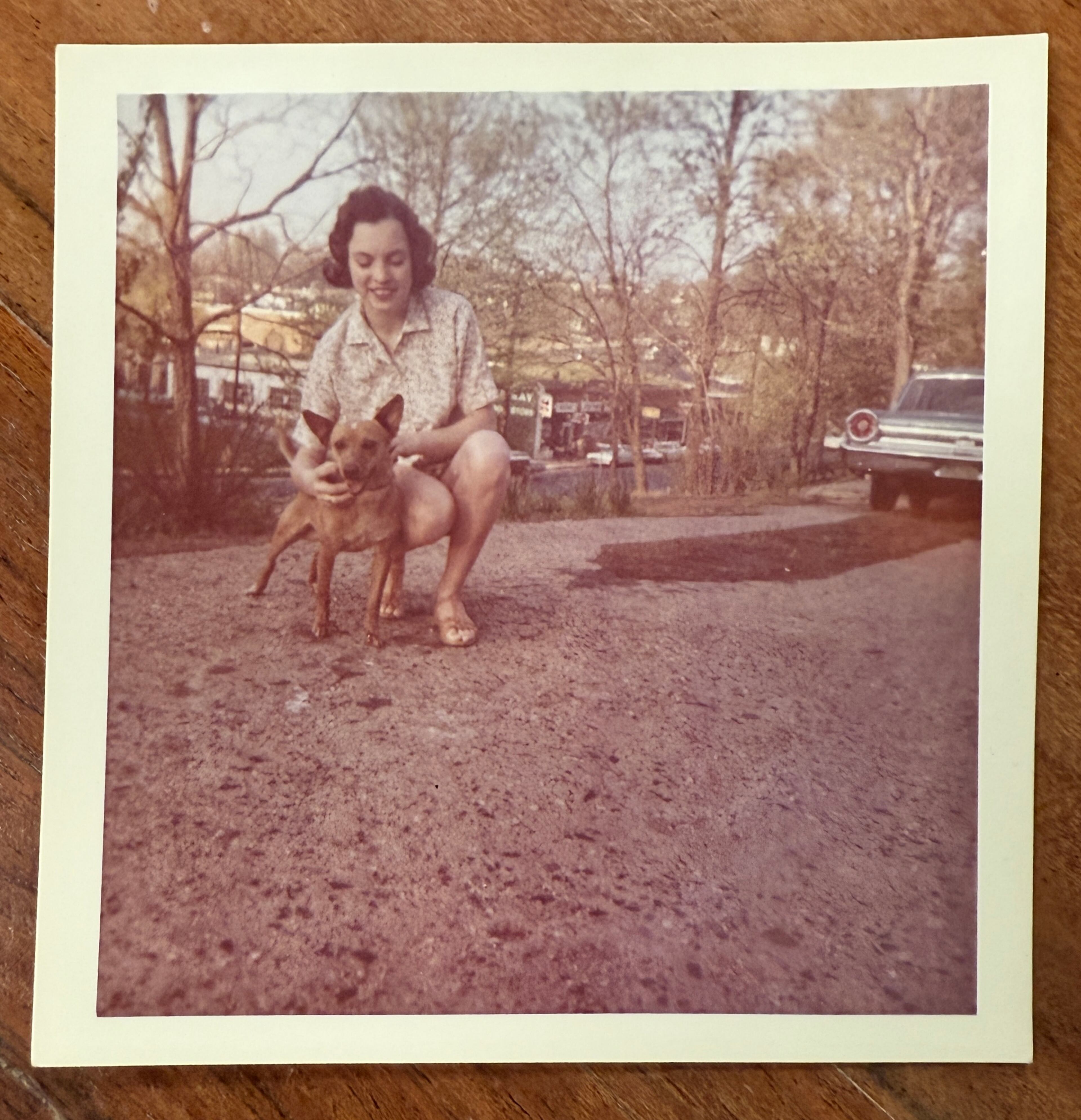 Marie George Myers still has a photograph with her dog, Rebel-Sam. The dog was given to her as a gift by one of her customers. (Courtesy of Marie George Myers)