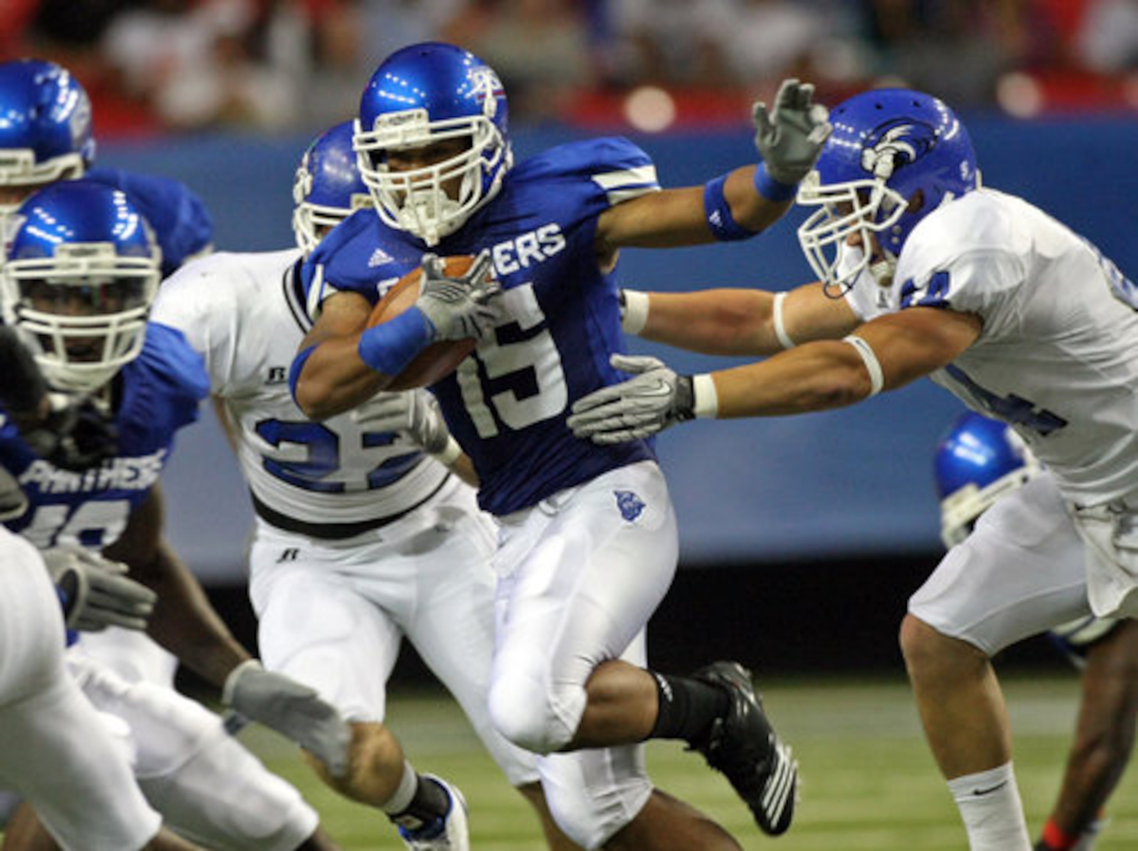 GSU's Albert Wilson (15) runs GSU's first ever play from the line of scrimmage in the first quarter of their game against Shorter College in the Georgia Dome Thursday night in Atlanta, Ga., Sept. 2, 2010. The play however would be called back because of a penalty.