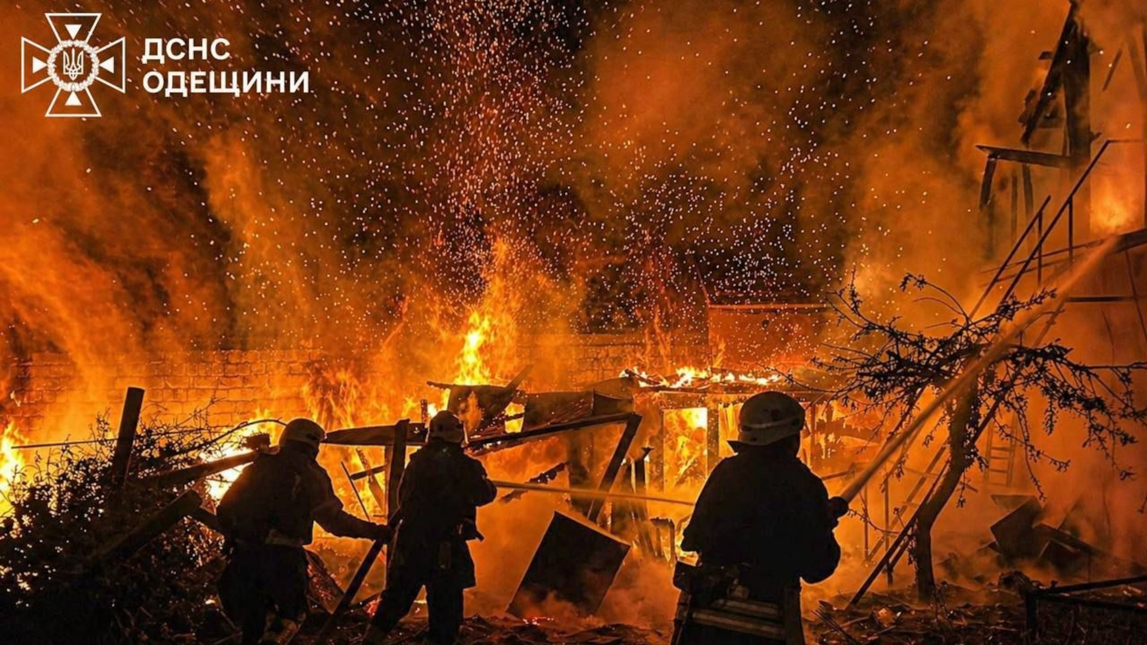 In this photo provided by the Ukrainian Emergency Services on Wednesday, April 29, 2026, rescue workers put out a fire of a residential building destroyed by a Russian drone strike on Odesa region, Ukraine. (Ukrainian Emergency Service via AP)