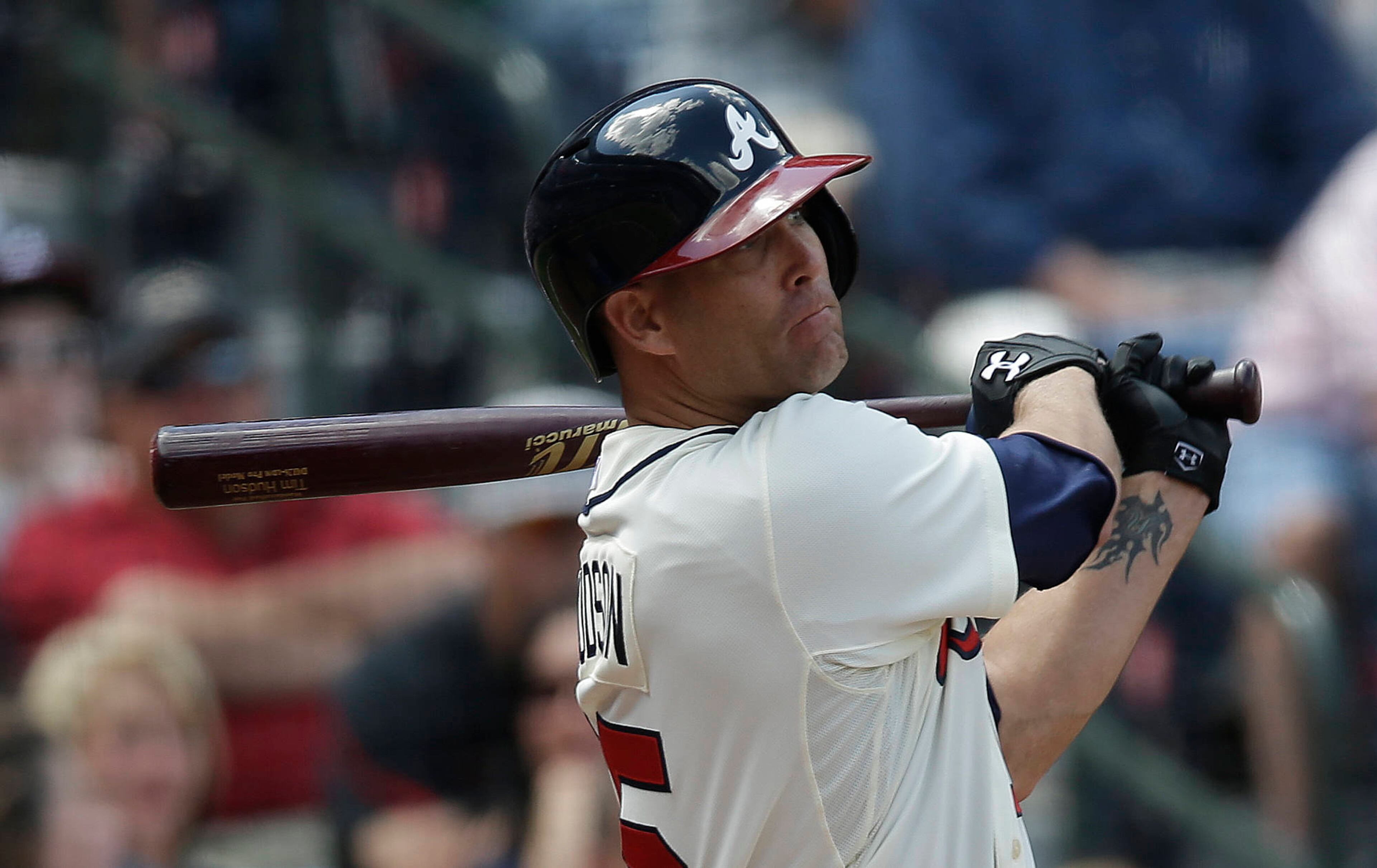 Atlanta Braves' Tim Hudson (15) follows through with an RBI-base hit in the sixth inning.