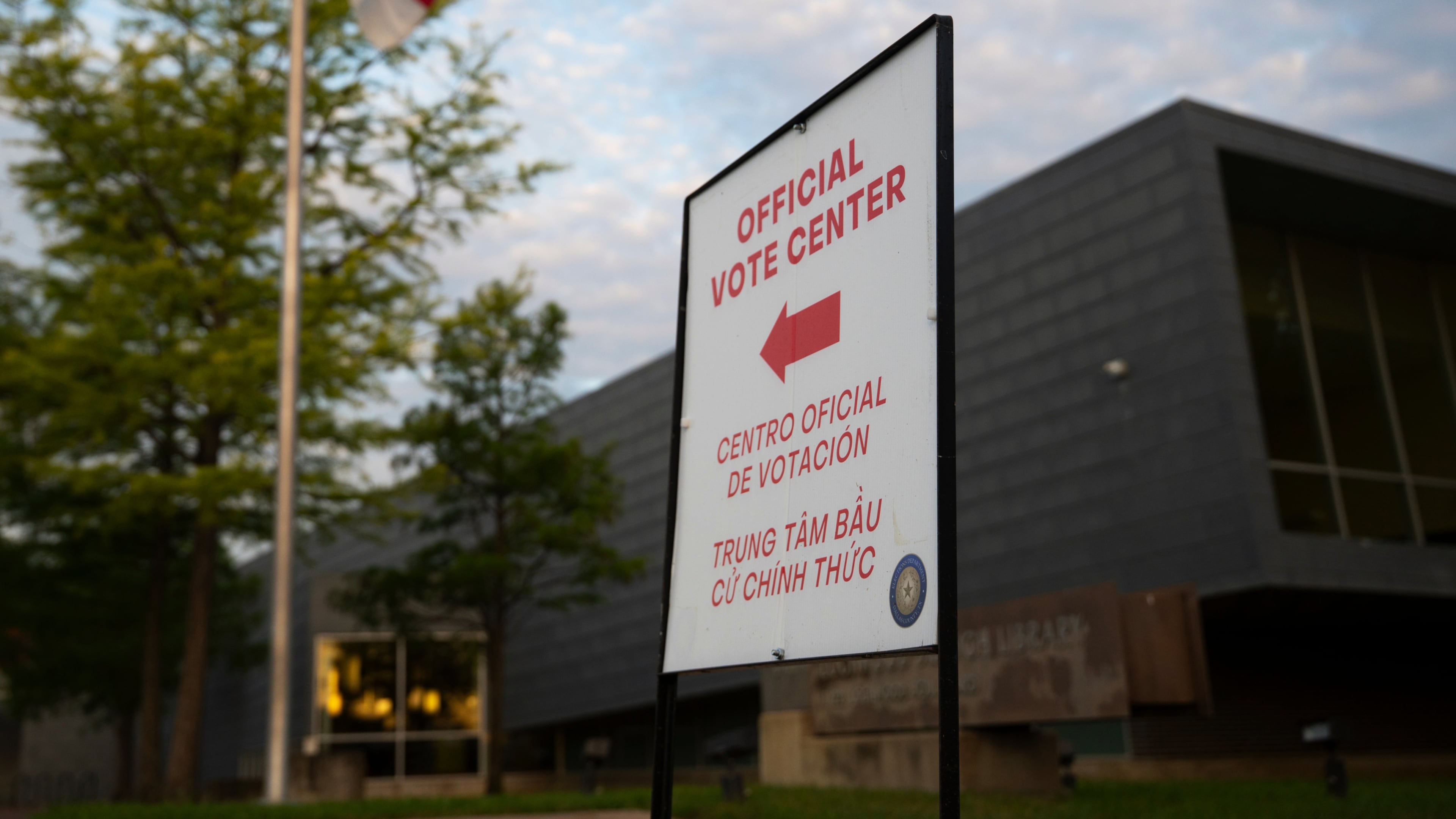 FILE - An official voting center sign stands outside of a polling location on May 26, 2026, in Dallas. (AP Photo/Gabriela Passos, File)