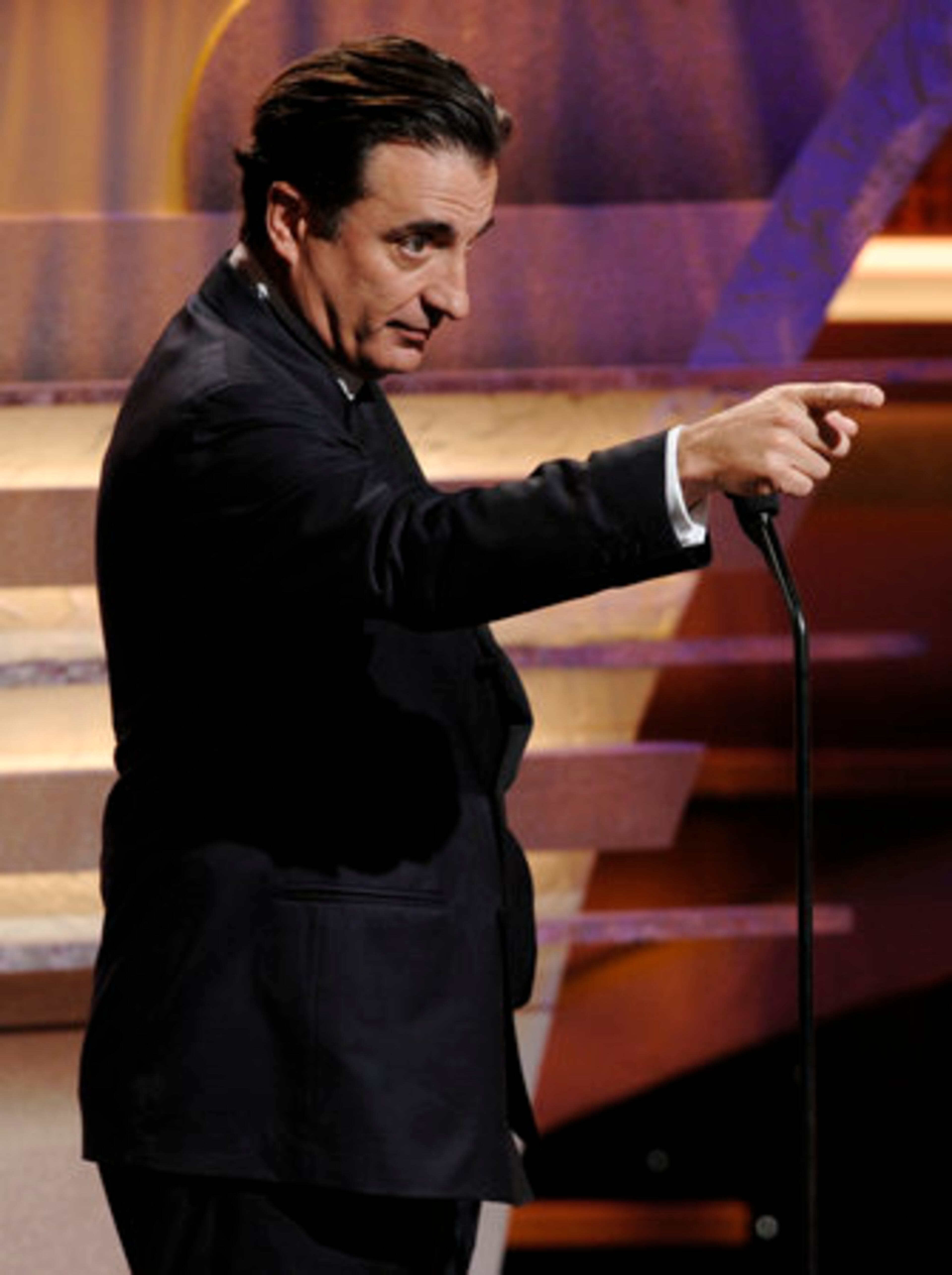 Actor Andy Garcia gestures from the stage.