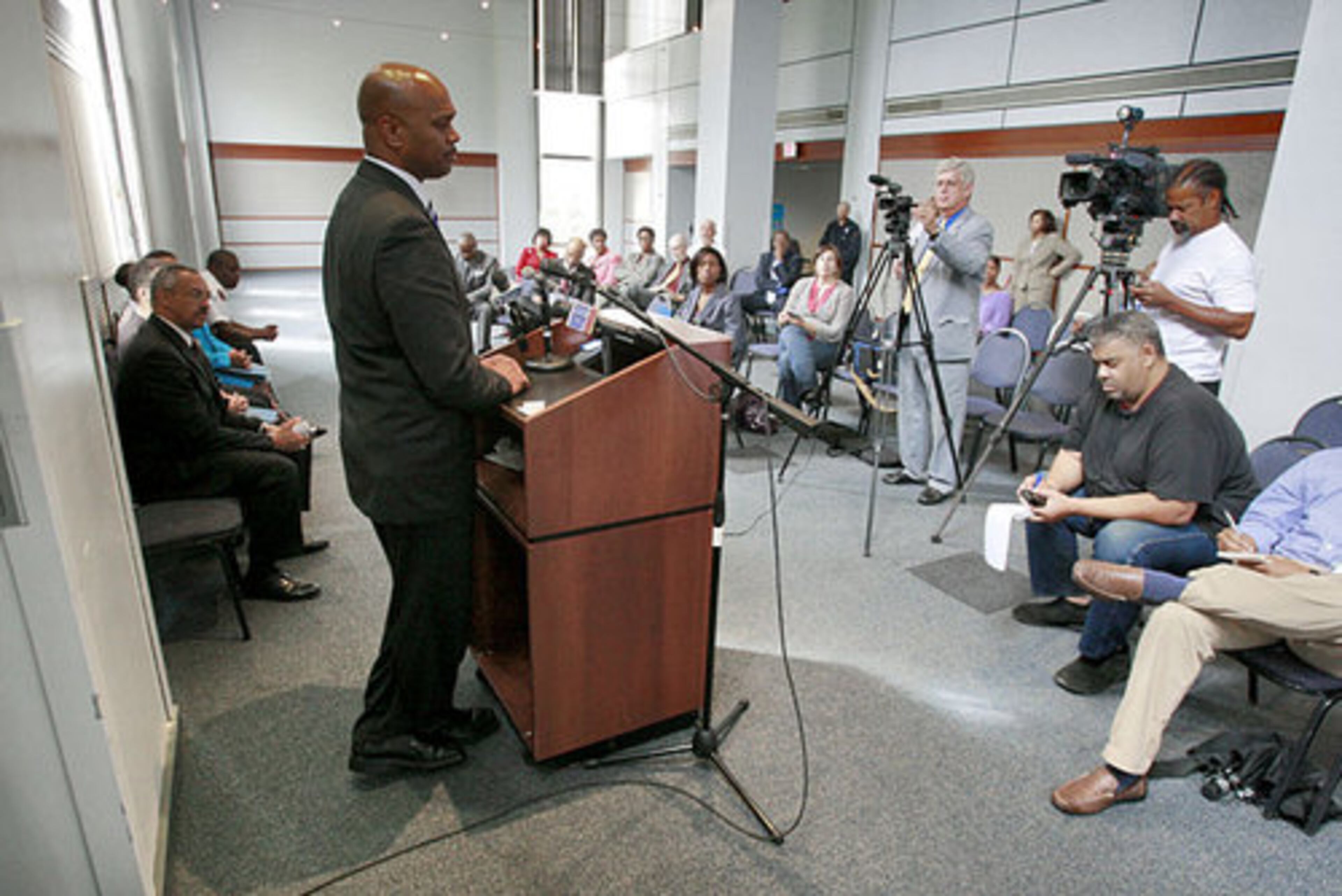 APD Lt. Keith Meadows addresses the noontime press conference. An 18-year-old student from Clark-Atlanta was also wounded when he was struck in the wrist by a stray bullet, Meadows said. That student's name has not been released.