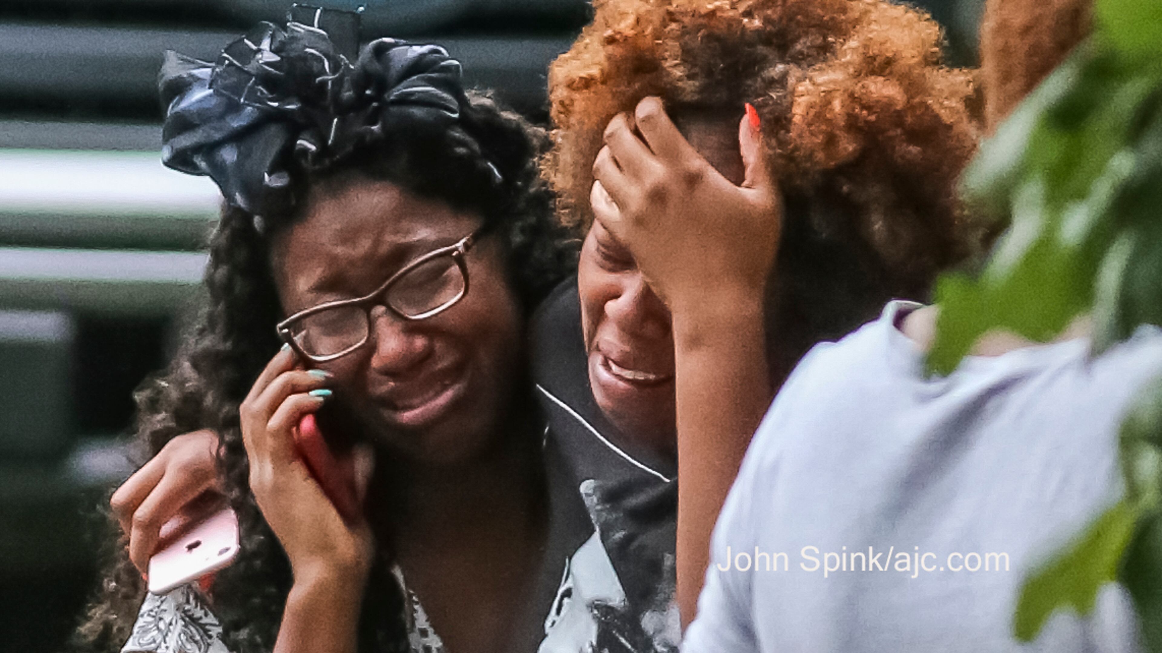 Emotions ran high Wednesday morning after three people were found dead in DeKalb County. JOHN SPINK / JSPINK@AJC.COM