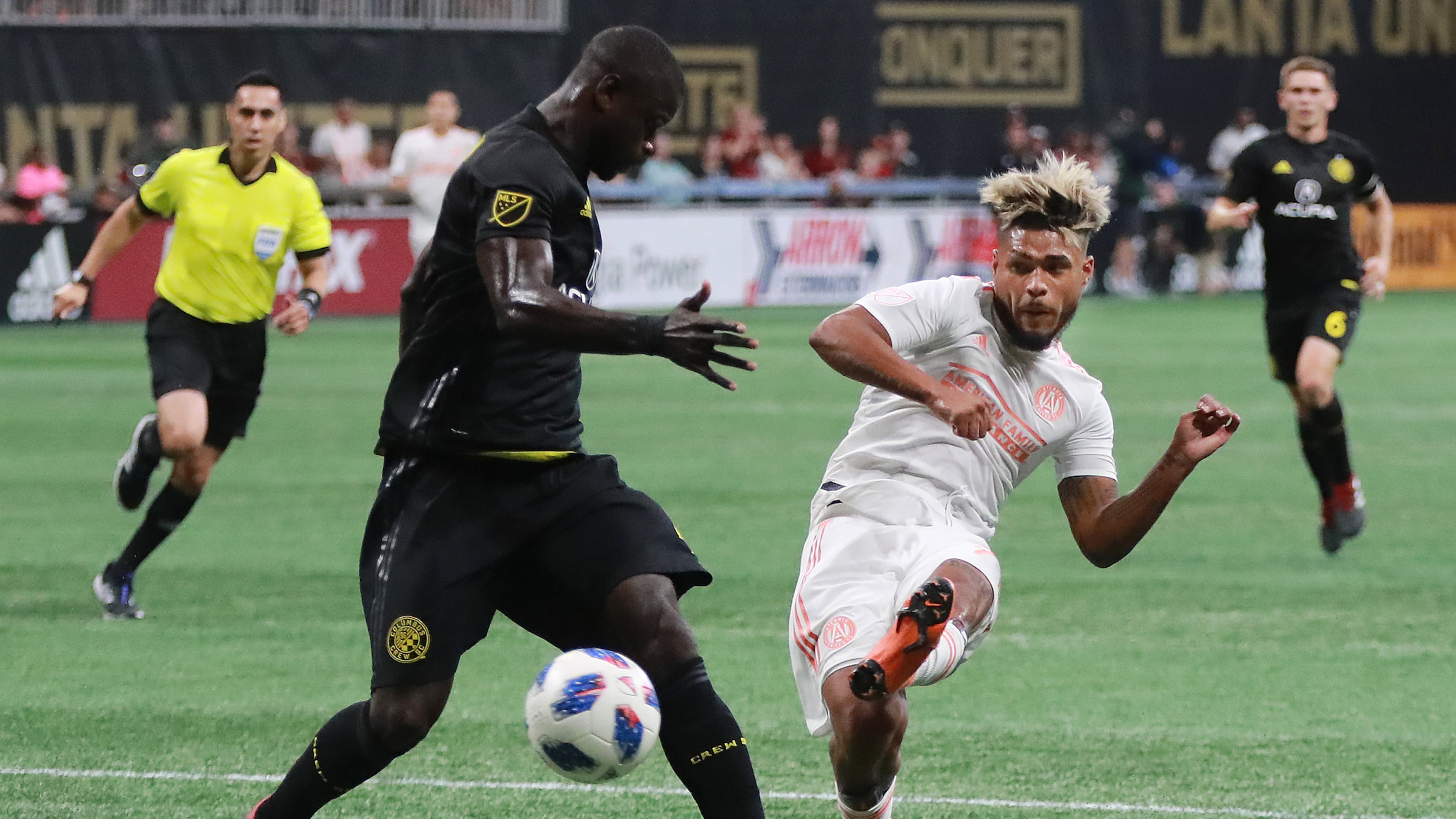 Atlanta United forward Josef Martinez makes the MLS season record tieing goal past Columbus Crew defender Jonathan Mensah for a 1-0 lead during the first half in a MLB soccer match on Sunday, August 19, 2018, in Atlanta. Curtis Compton/ccompton@ajc.com