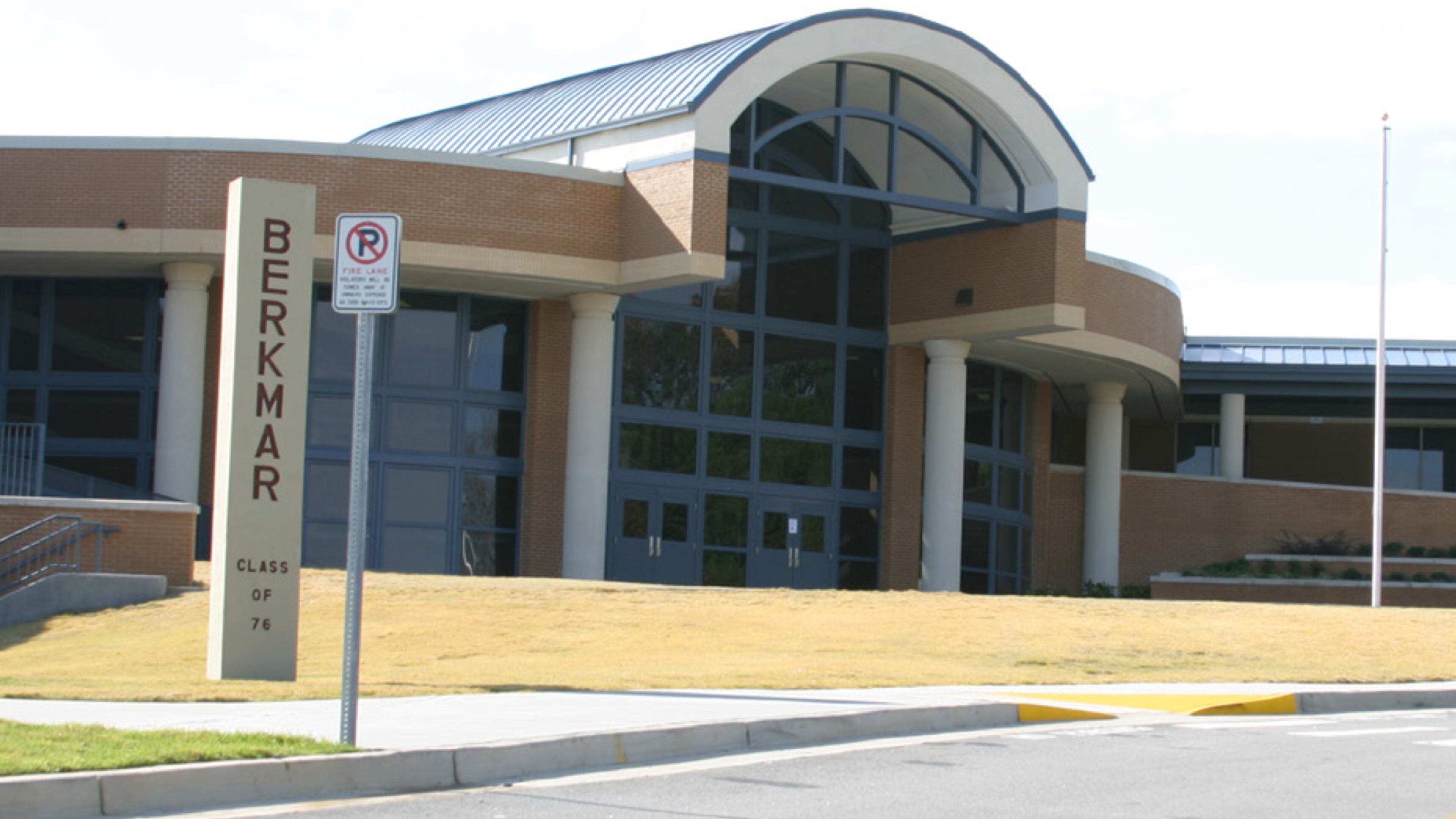 Three Berkmar High School students rescued a woman having a medical emergency from the road outside their school.