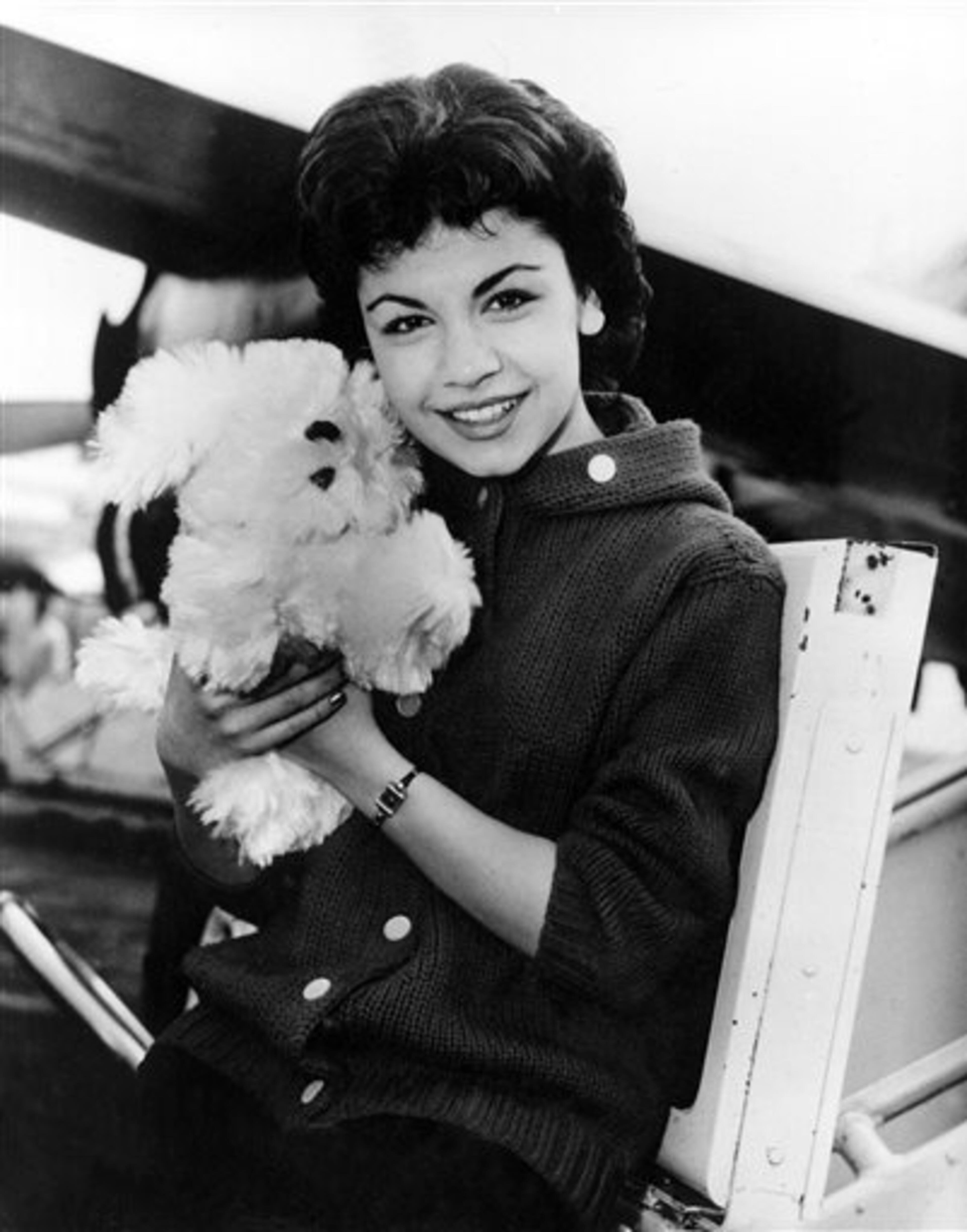 FILE - In this March 24, 1959 file photo, Walt Disney studio's new star, 16-year-old Annette Funicello, poses with her Shaggy Dog doll, at Idlewild Airport in New York. Walt Disney Co. says, Monday, April 8, 2013, that Funicello, also known for her beach movies with Frankie Avalon, has died at age 70. (AP Photo/File)