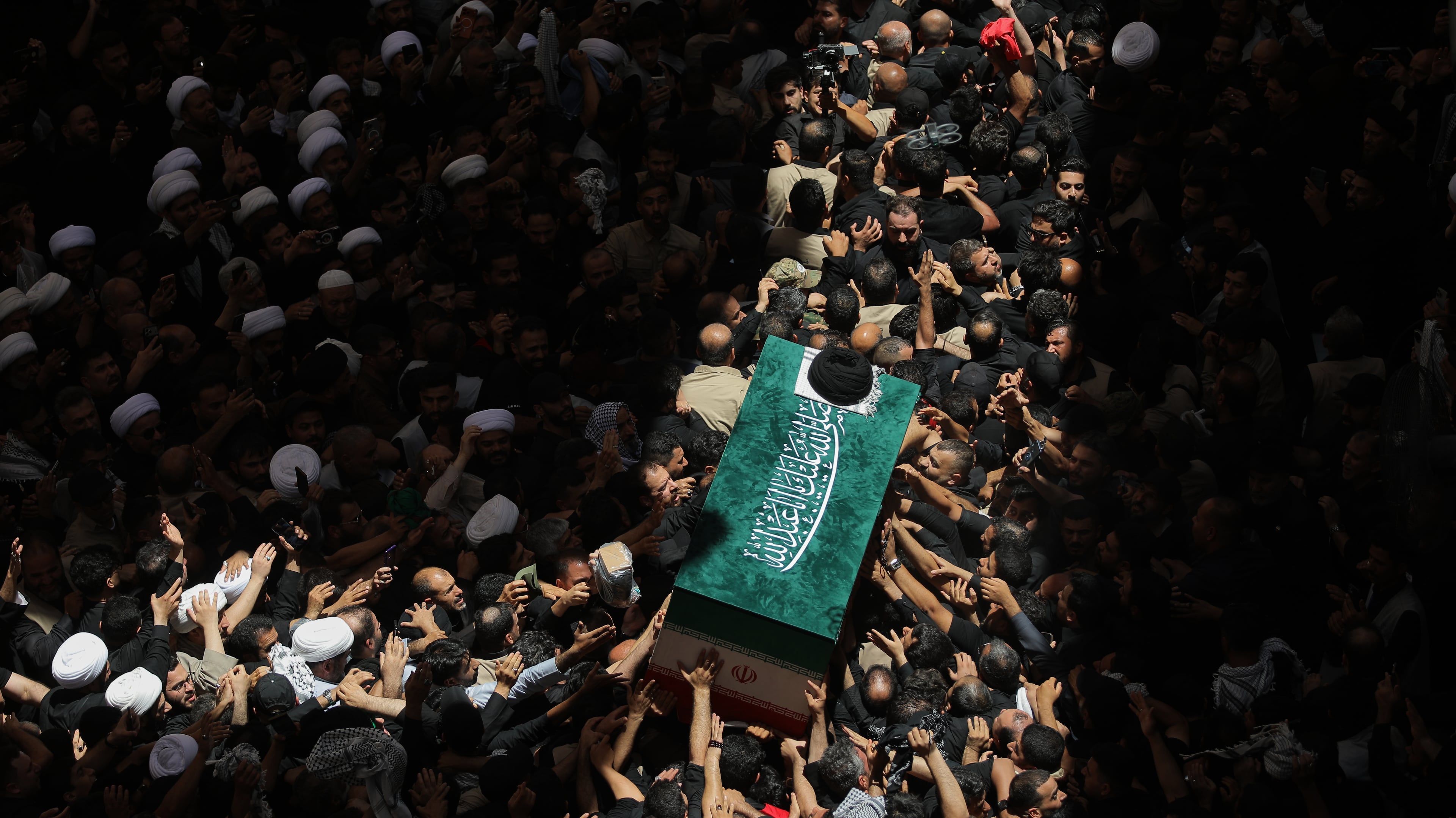 The coffin of the late Iranian Supreme Leader Ayatollah Ali Khamenei is carried by mourners to the Imam Ali Shrine in Najaf, Iraq, Wednesday, July 8, 2026. (AP Photo/Anmar Khalil)