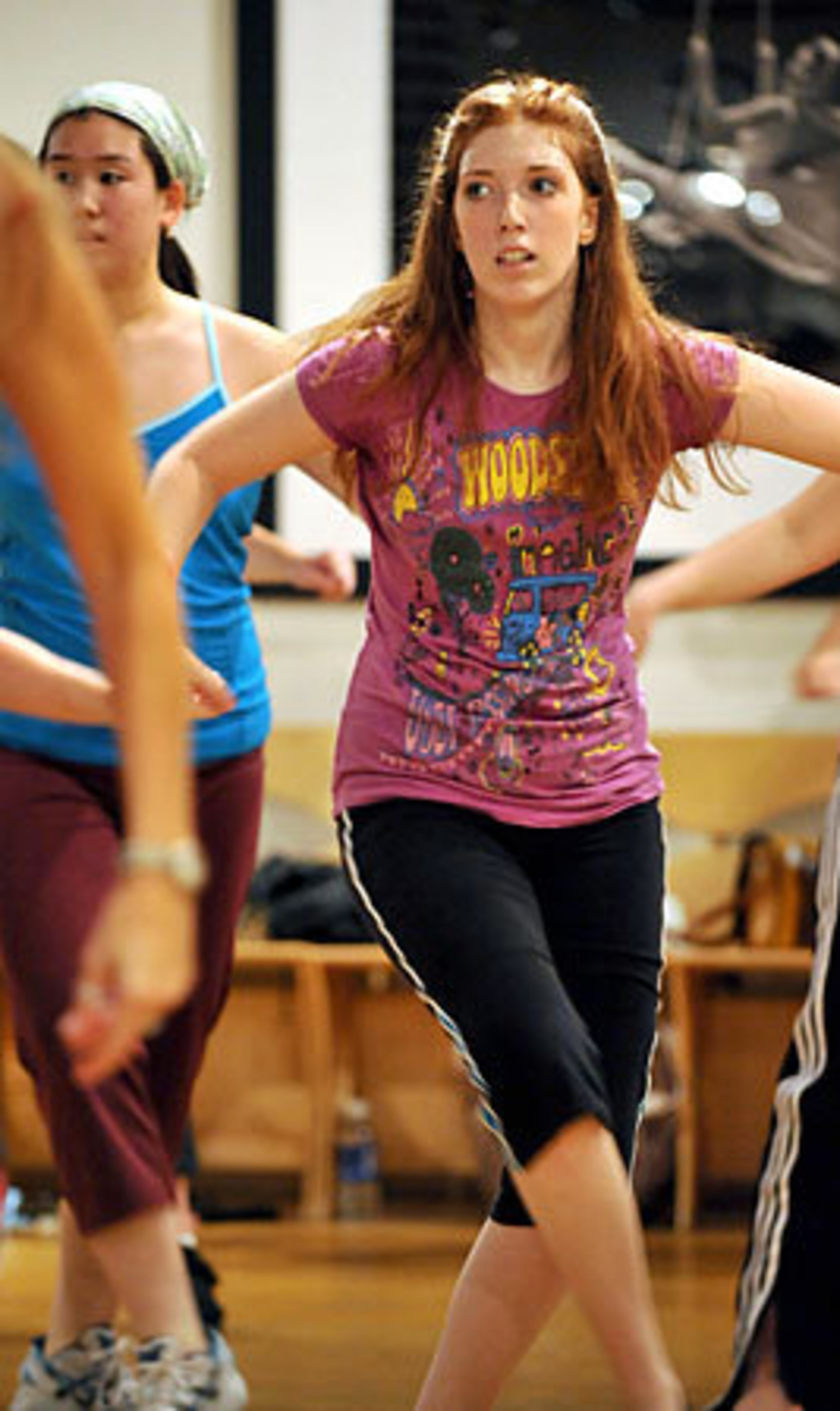 Aly Calder, of Atlanta, follows Fernandes' instruction during class.