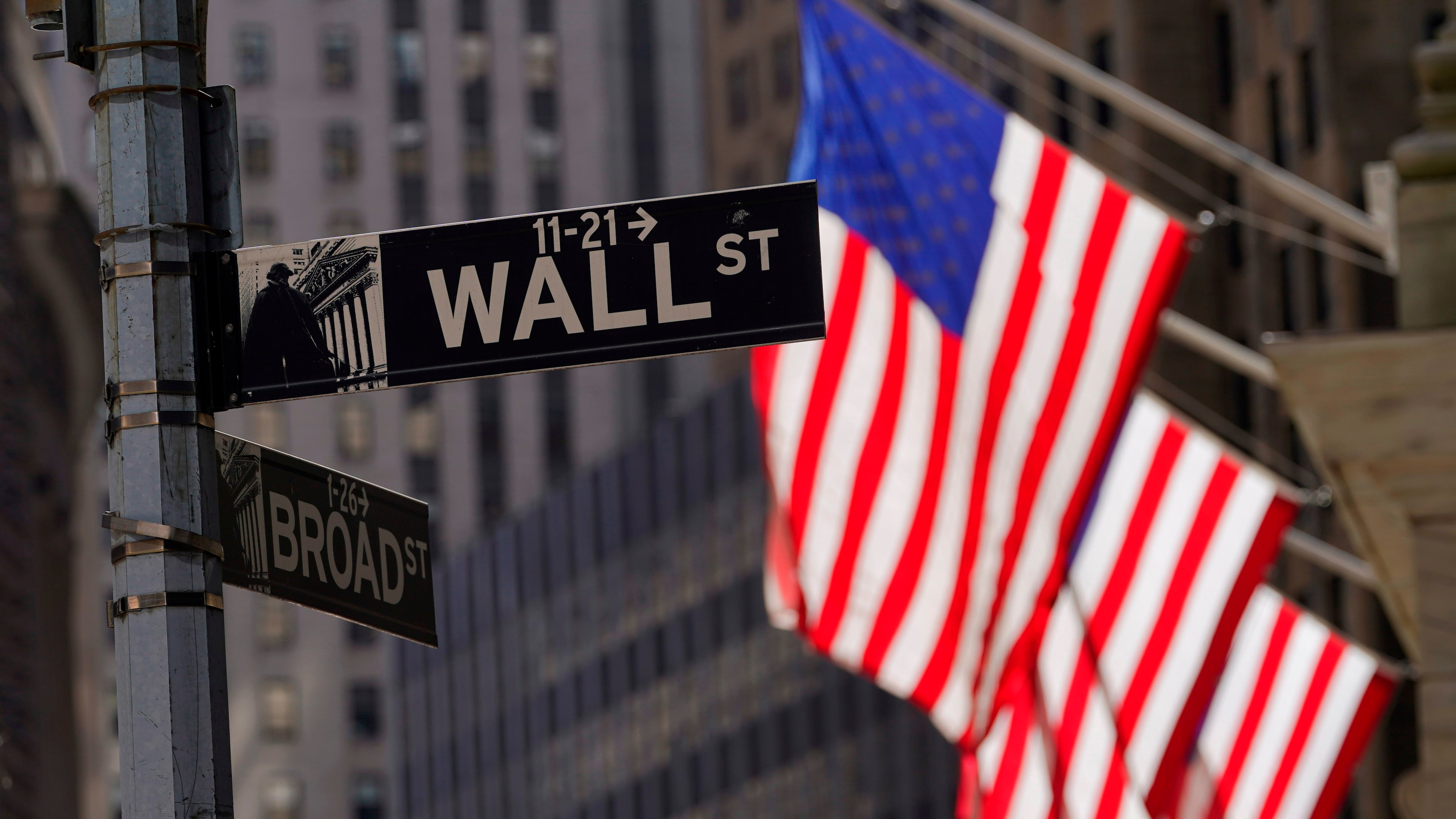FILE - American flags fly outside the New York Stock Exchange, Friday, Sept. 23, 2022, in New York. (AP Photo/Mary Altaffer, File)