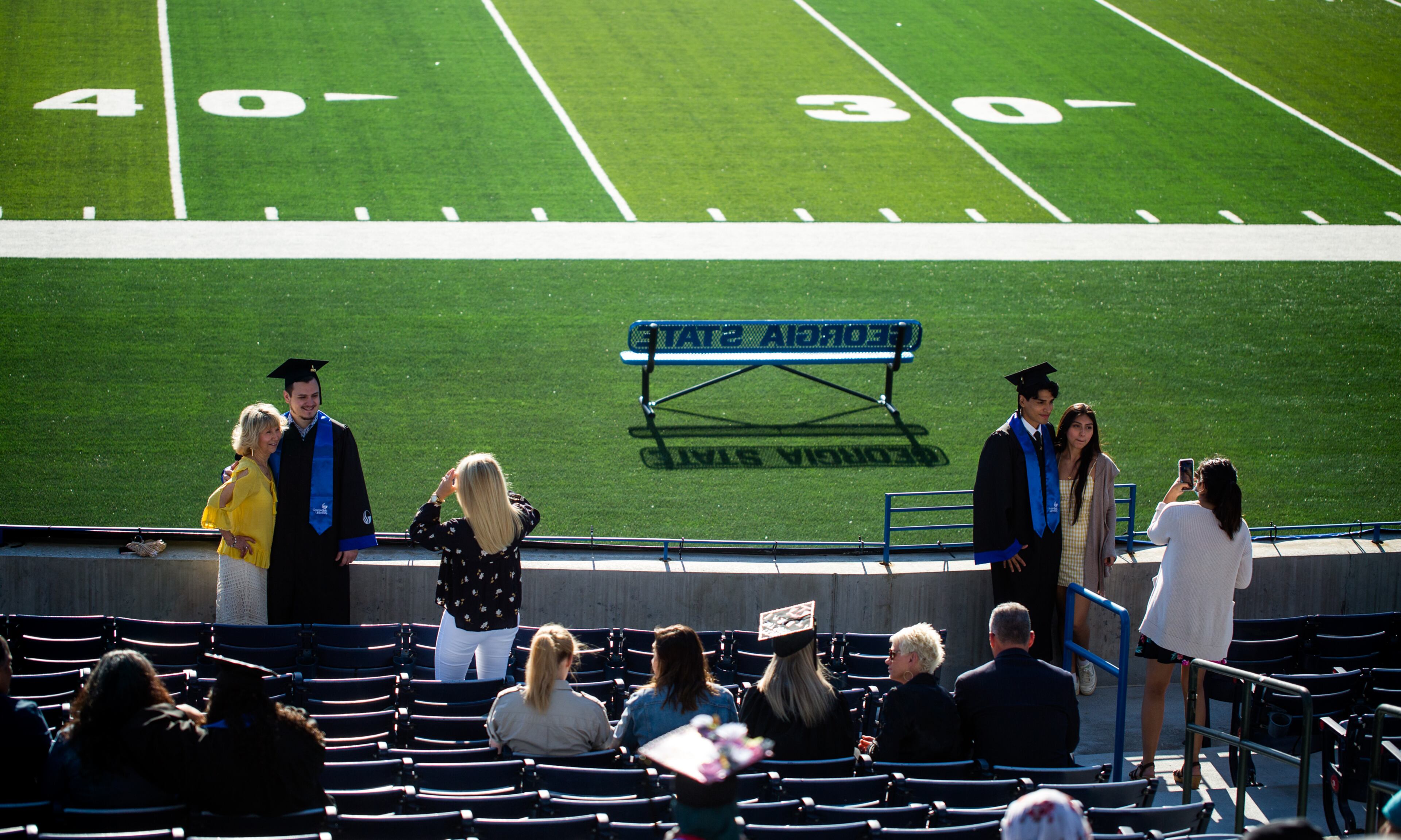 Georgia State University graduation at Center Parc Stadium on Thursday, May 6, 2021 has adjusted for the pandemic with graduates placed in pods where they celebrate with friends and family as their names are read, rather than walking the stage. GSU graduated 5000 students this year. (Jenni Girtman for The Atlanta Journal - Constitution)