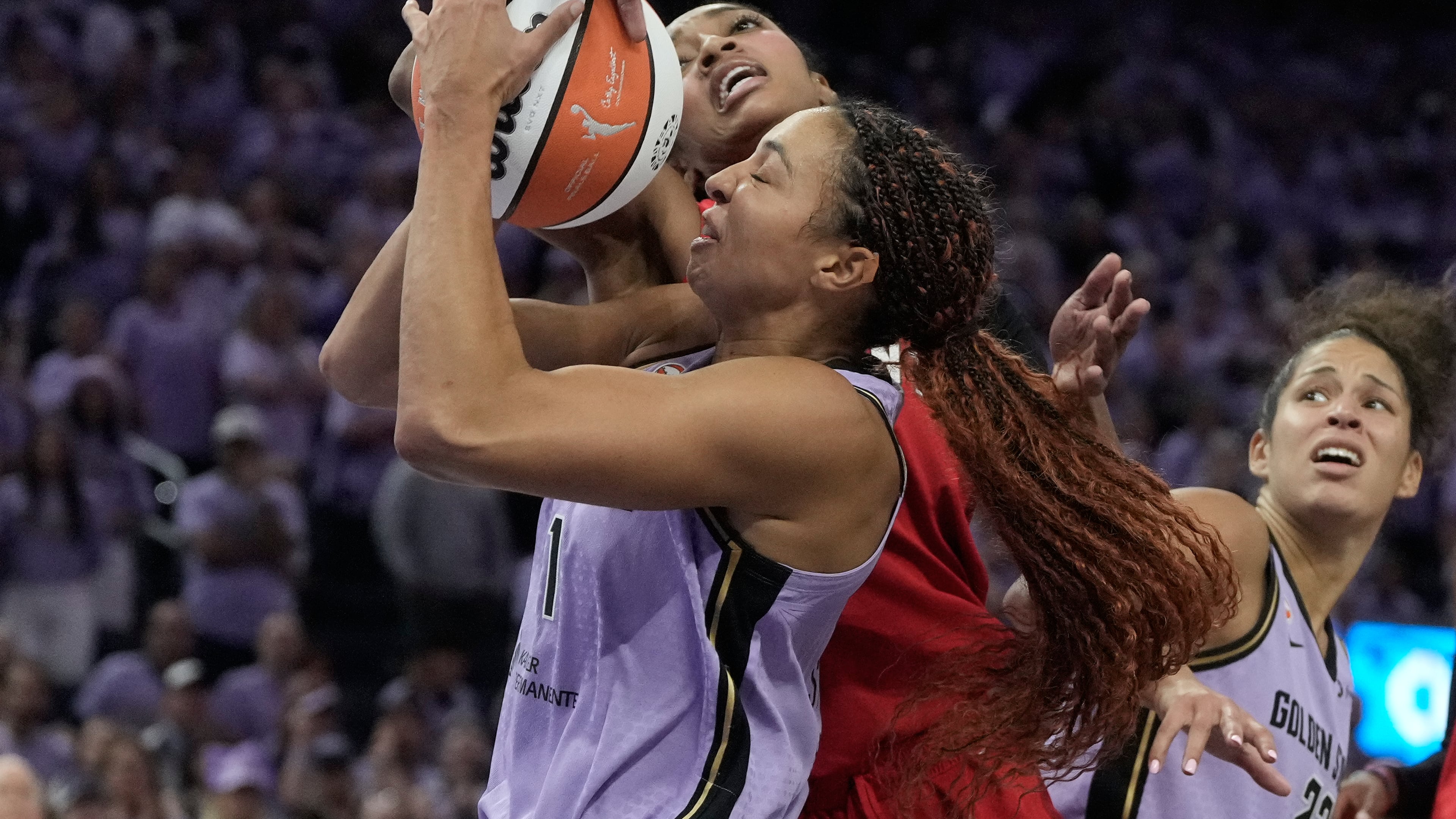 Golden State Valkyries center Kiah Stokes, bottom, is fouled by Atlanta Dream forward Angel Reese, top, during the second half of Game 1 of the WNBA basketball finals, Saturday, Oct. 17, 2026, in San Francisco. (AP Photo/Jeff Chiu)