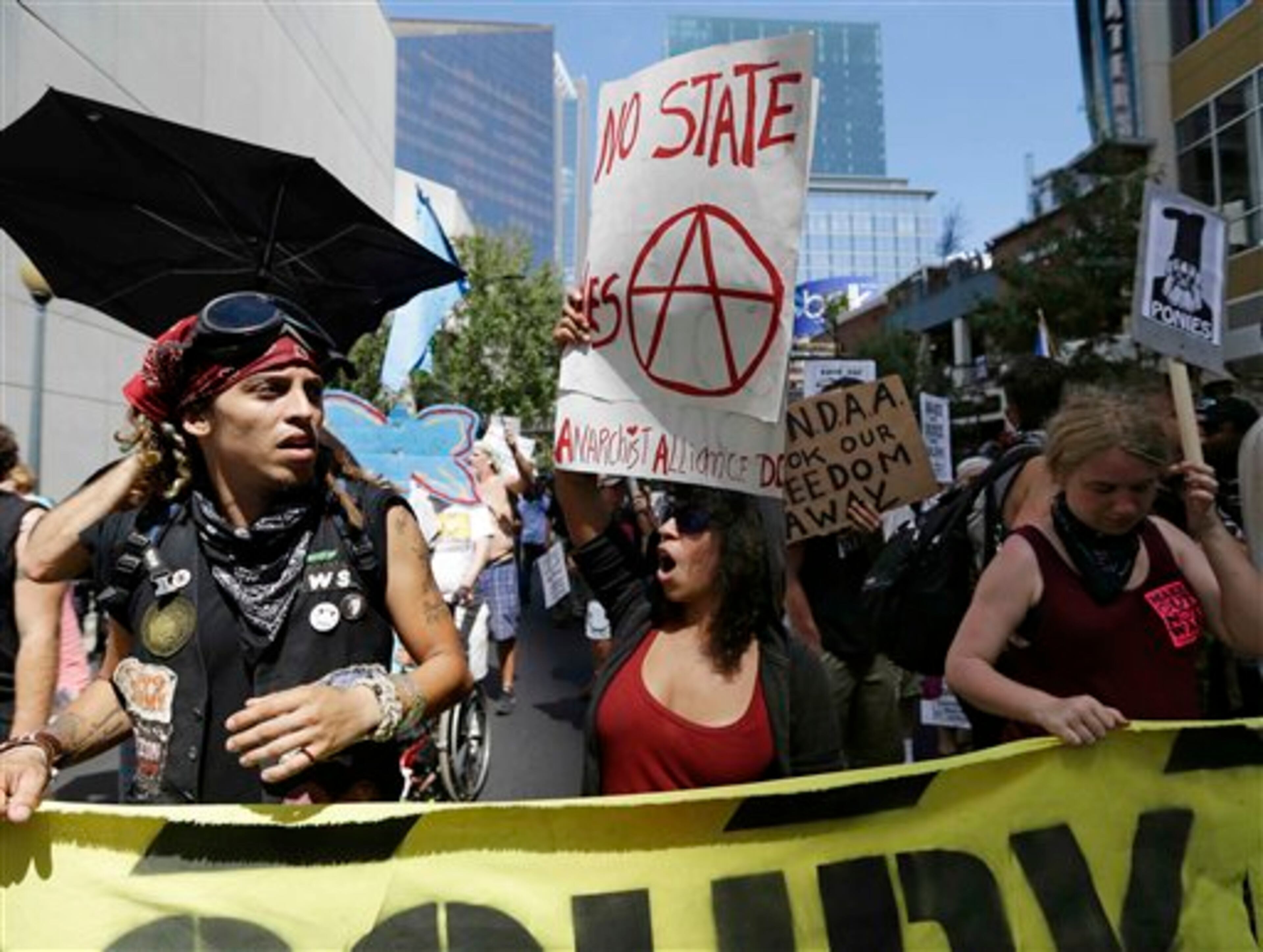 Demonstrators chant during a protest march, Sunday, Sept. 2, 2012, in Charlotte, N.C. Demonstrators are protesting before the start of the Democratic National Convention. (AP Photo/Patrick Semansky)