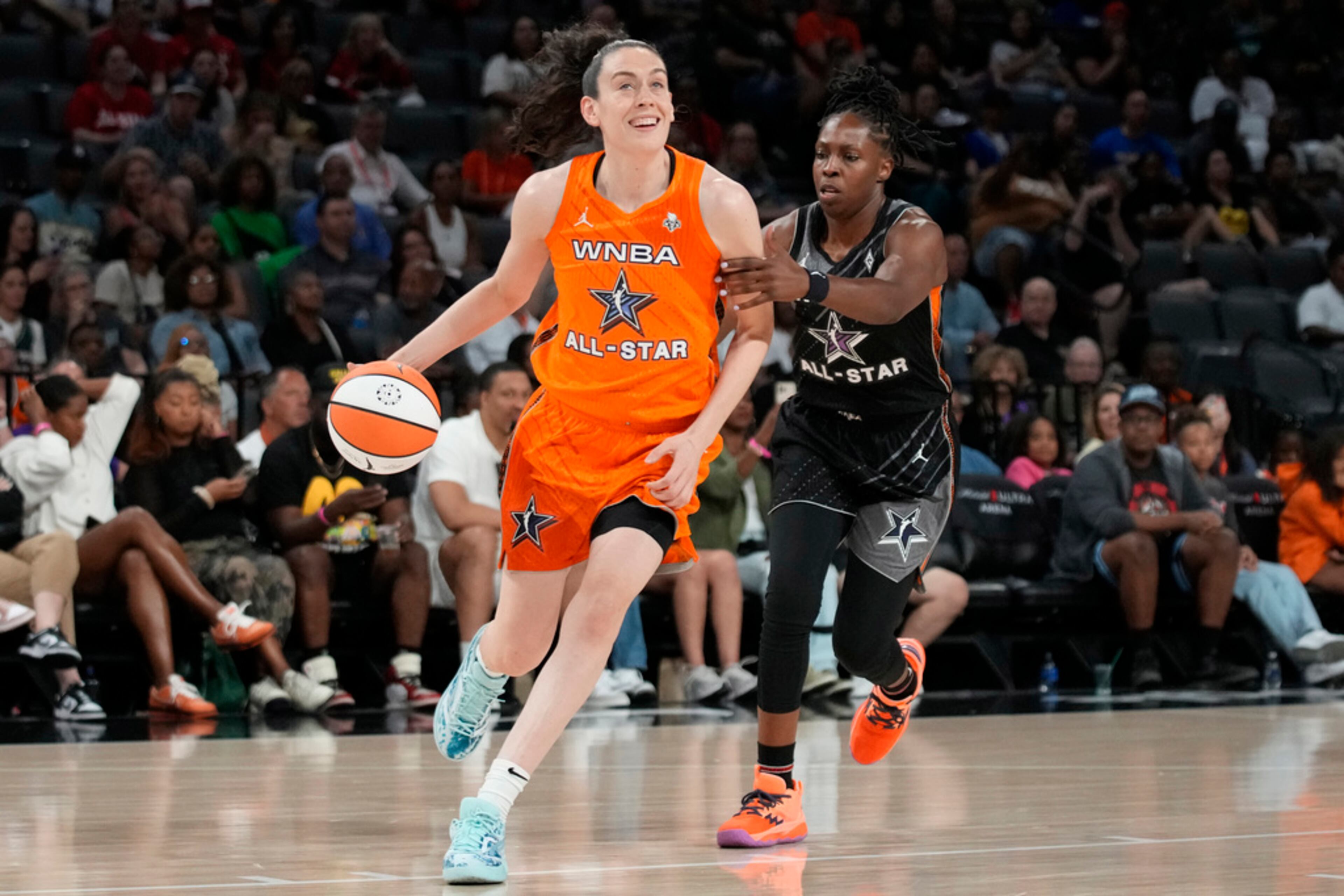New York Liberty's Breanna Stewart, of Team Stewart, drives around Las Vegas Aces' Chelsea Gray, of Team Wilson, during the second half of a WNBA All-Star basketball game Saturday, July 15, 2023, in Las Vegas. (AP Photo/John Locher)
