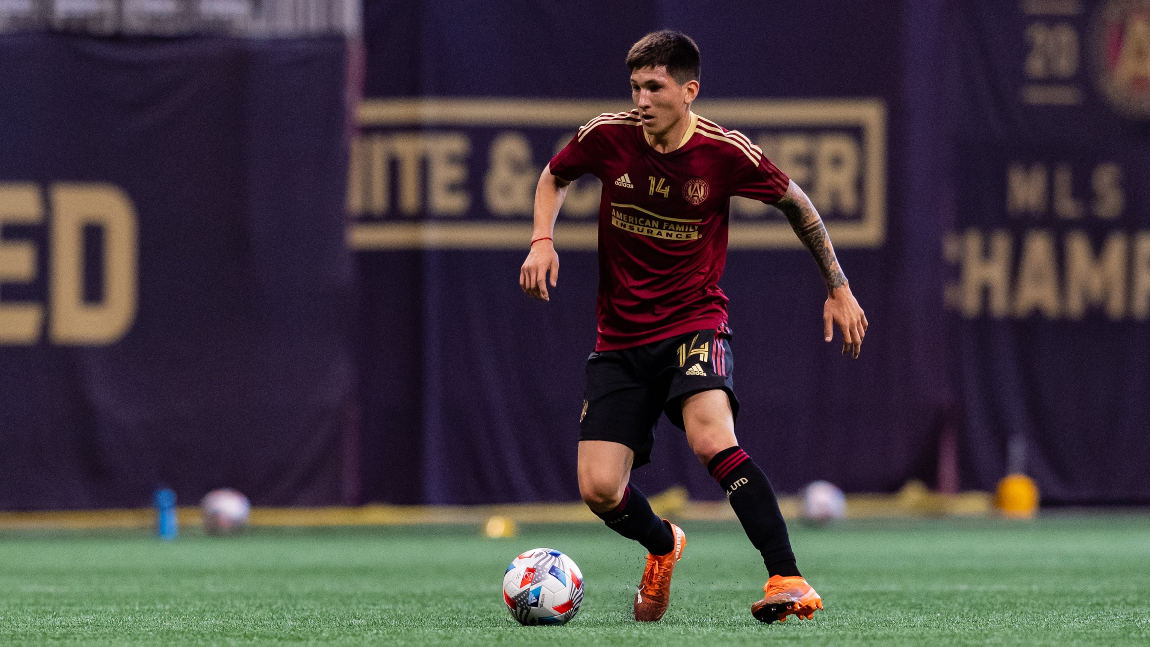 Atlanta United midfielder Franco Ibarra (14) dribbles the ball during the preseason scrimmage against Charleston Battery Saturday, March 20, 2021, at Mercedes-Benz Stadium in Atlanta. (Jacob Gonzalez/Atlanta United)