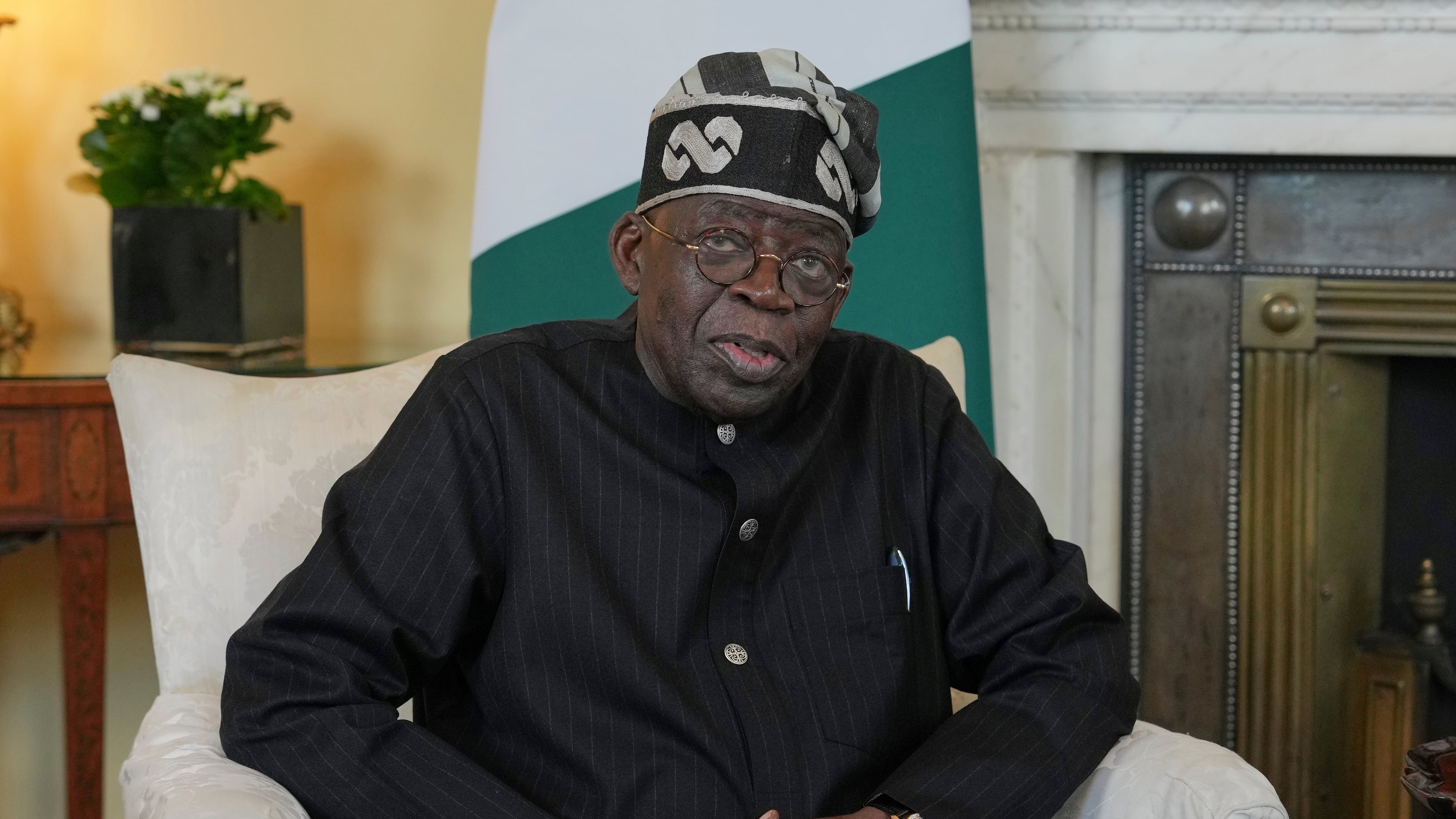 FILE - President of Nigeria Bola Ahmed Tinubu speaks to the media ahead of his meeting with Britain's Prime Minister Keir Starmer inside 10 Downing Street in London, Thursday, March 19, 2026. (AP Photo/Kin Cheung, Pool File)