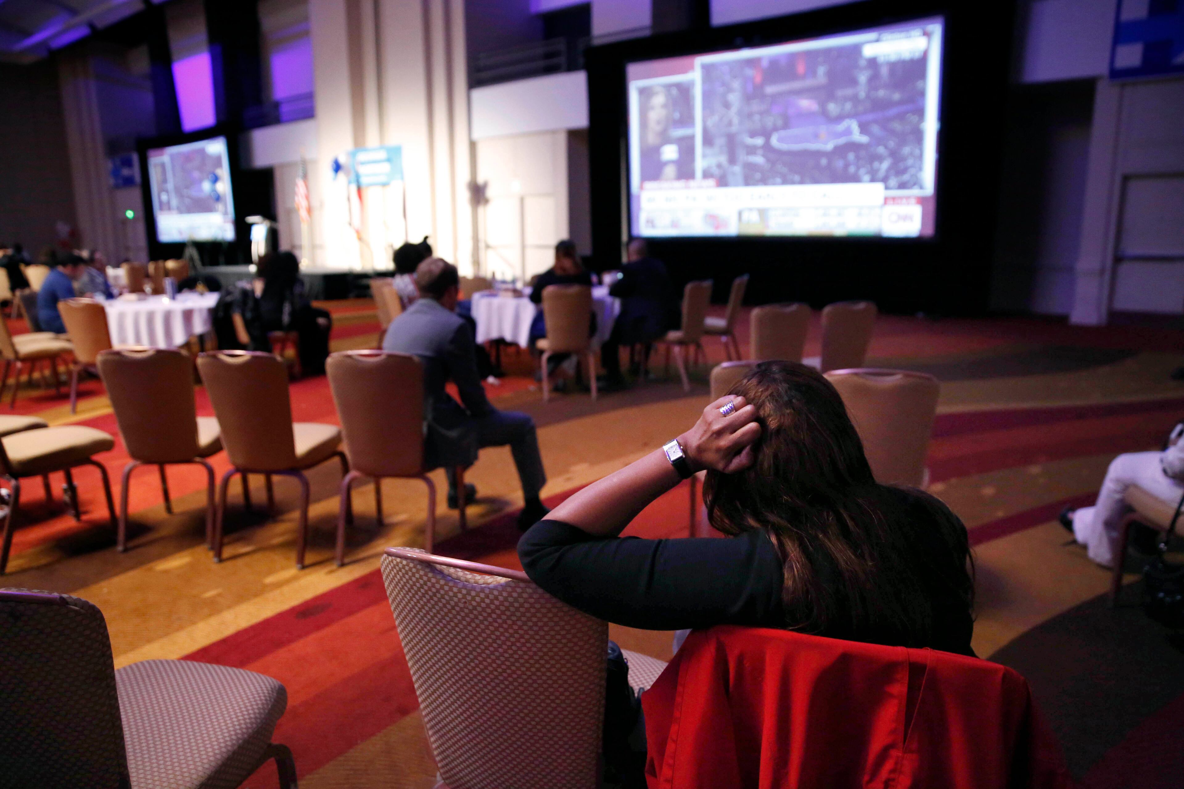 A Hillary Clinton supporter watches voting results after many have left the Democratic Party of Georgia Election Night Party at the Hyatt Regency Atlanta Tuesday November 8, 2016, in Atlanta, Ga. (JASON GETZ)