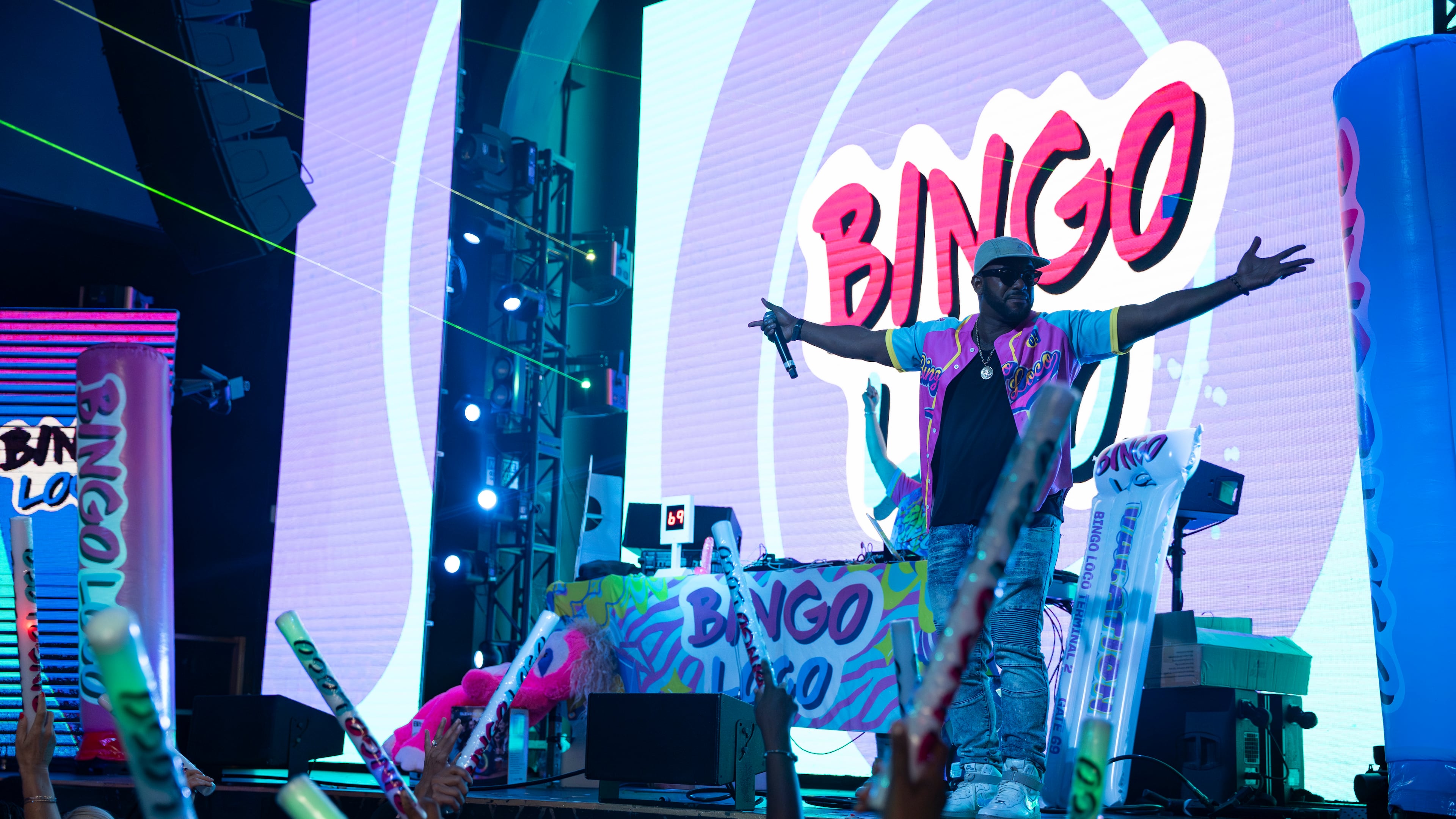 The emcee warms up the crowd from the stage during Bingo Loco at Believe Music Hall in Atlanta on Saturday, July 18, 2026. (Olivia Bowdoin for the AJC)