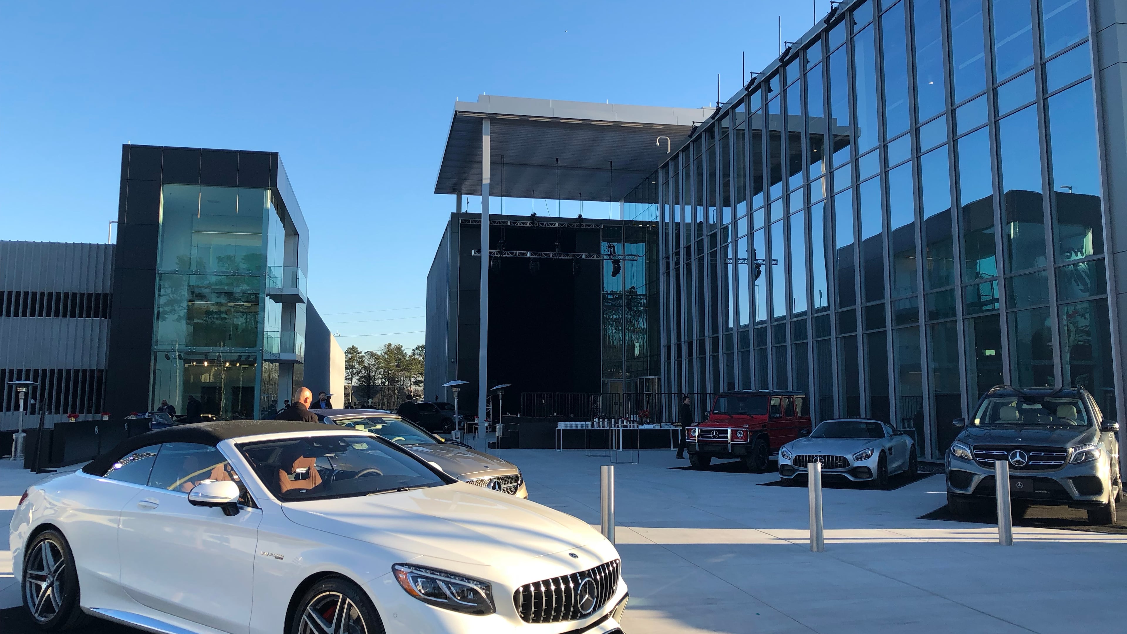 In this March 2018 photo, Mercedes-Benz luxury cars are parked outside before the opening ceremony of the company’s headquarters in Sandy Springs. (J. Scott Trubey/AJC)