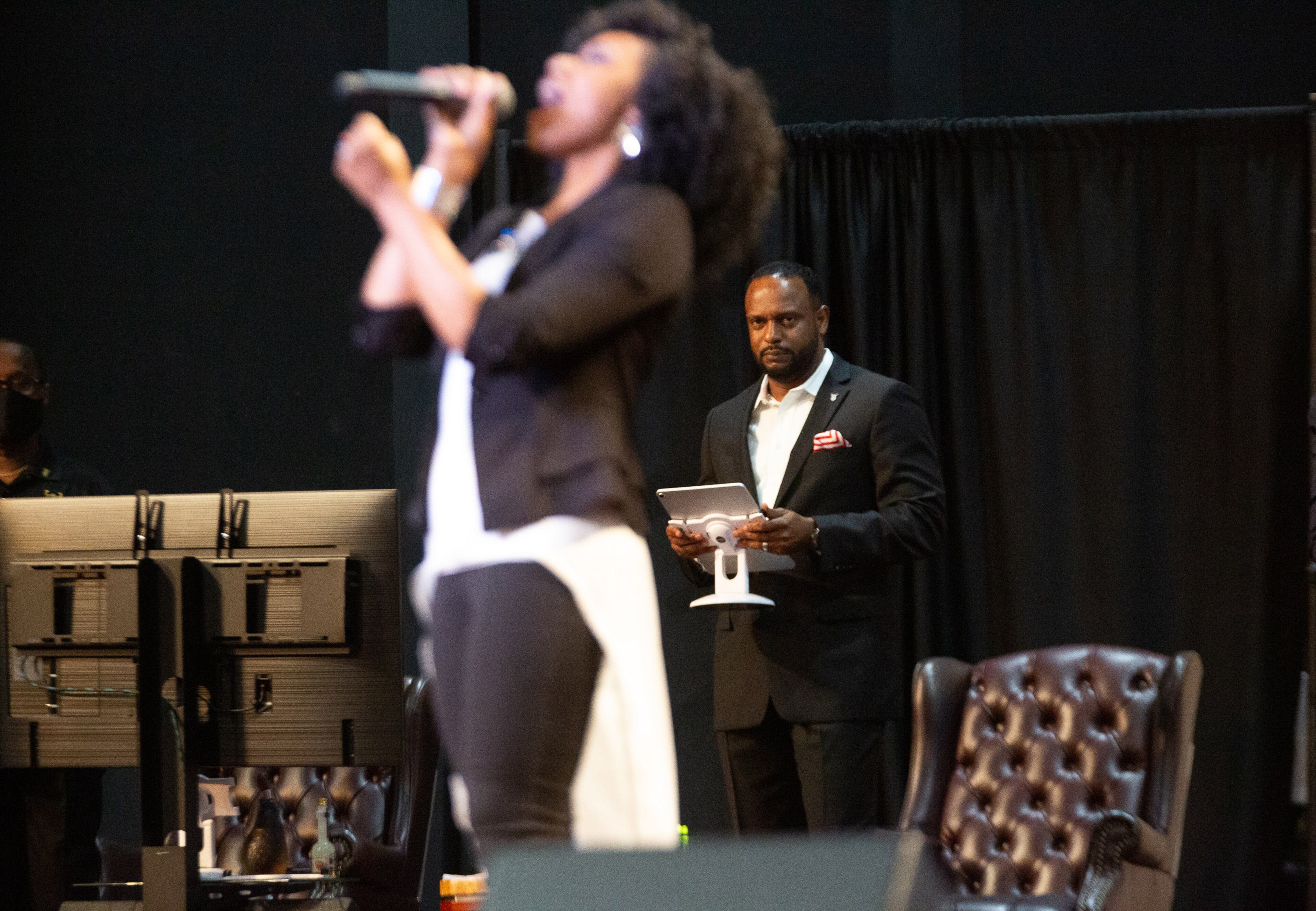 Pastor Jesse Curney III of the New Mercies Christian Church in Lilburn watches Praise and Worship singer April Thompson perform during the church service Sunday, August 2, 2020. STEVE SCHAEFER FOR THE ATLANTA JOURNAL-CONSTITUTION