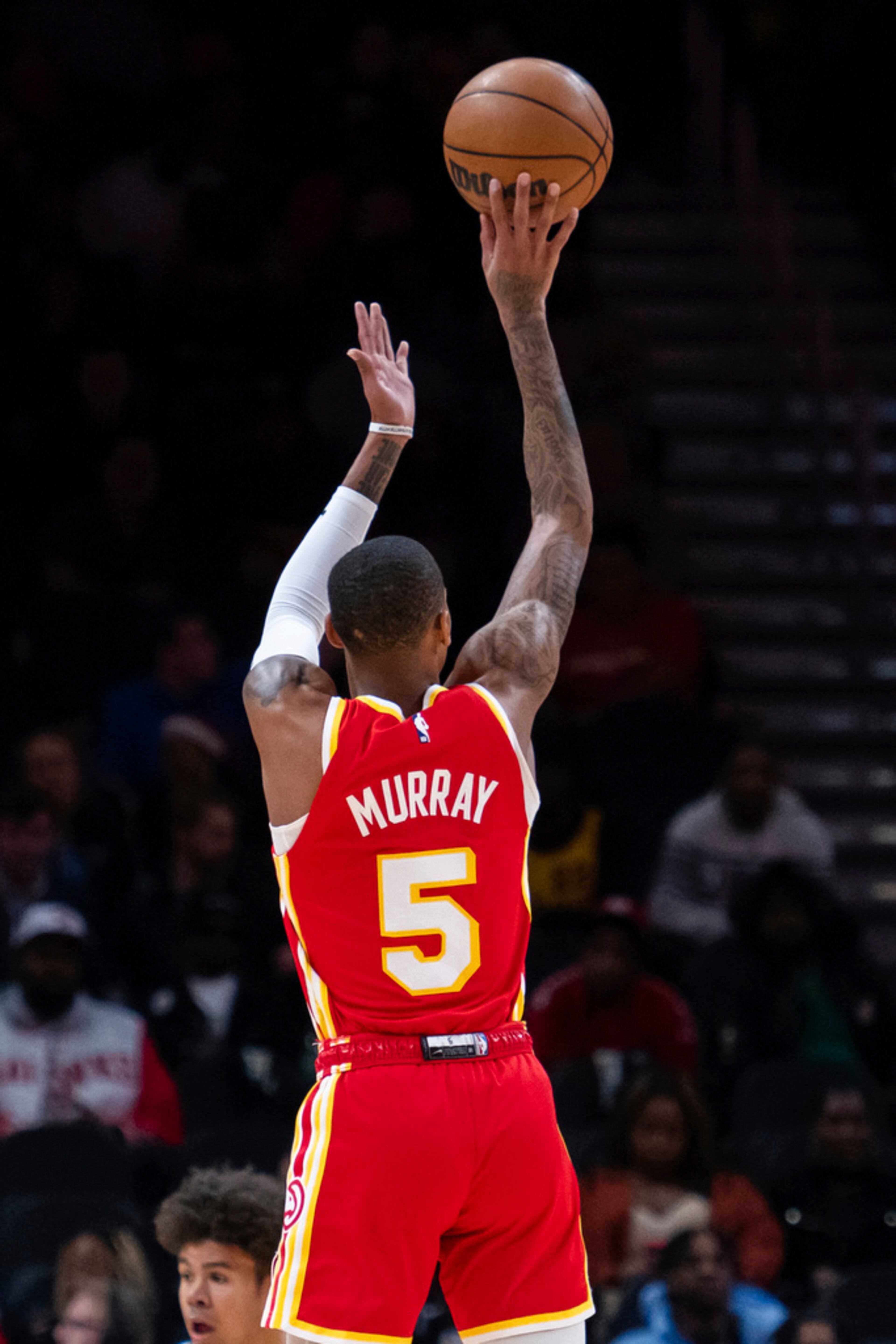 Atlanta Hawks guard Dejounte Murray (5) shoots a 3-pointer against the Brooklyn Nets during the first half of an NBA basketball game Wednesday, Dec. 6, 2023, in Atlanta. (AP Photo/Hakim Wright Sr.)