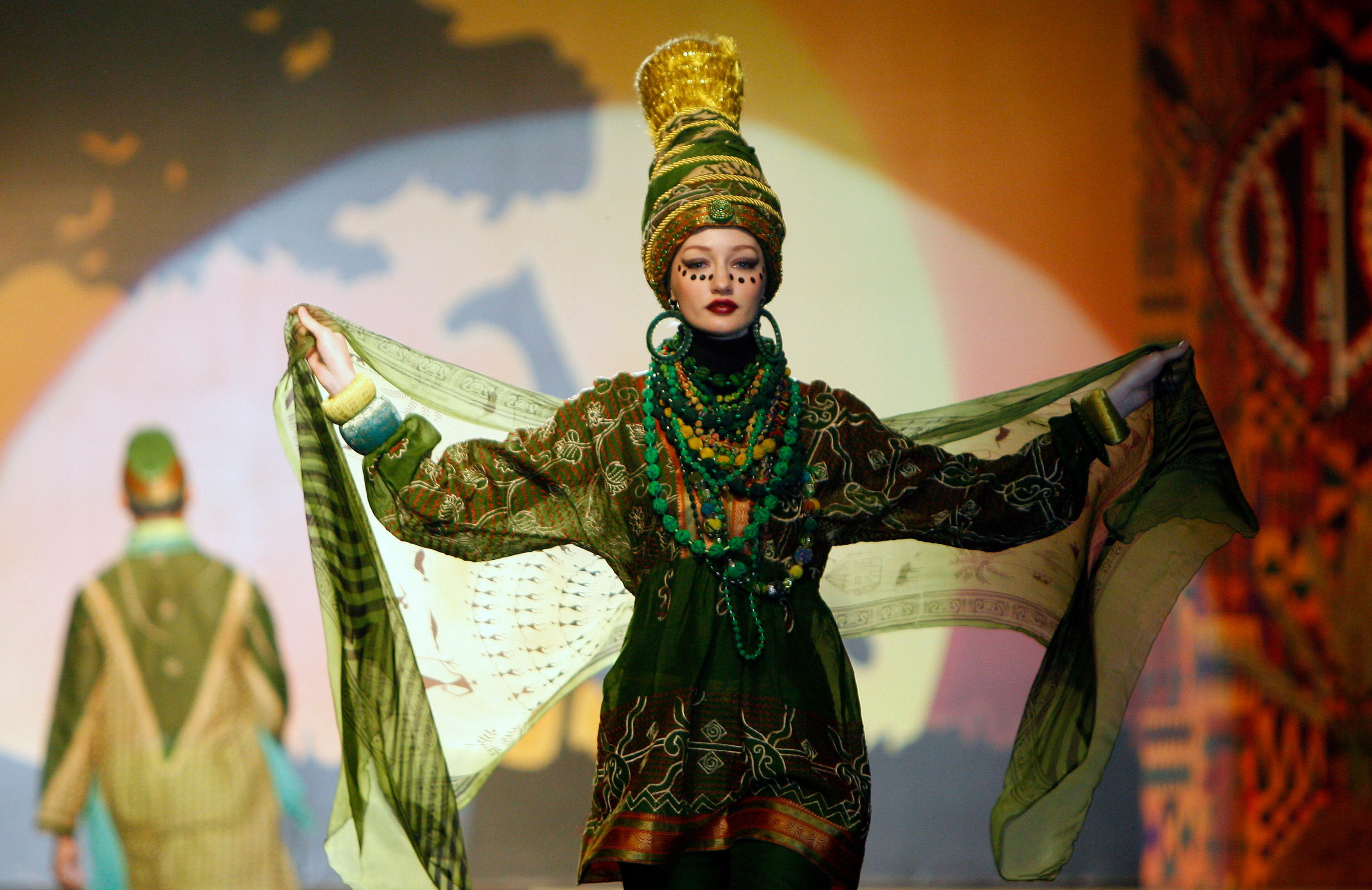 A model presents a creation by designer Paul Robb from Indonesia during the Islamic Fashion Festival in Kuala Lumpur, Malaysia, Monday, Nov. 5, 2012.