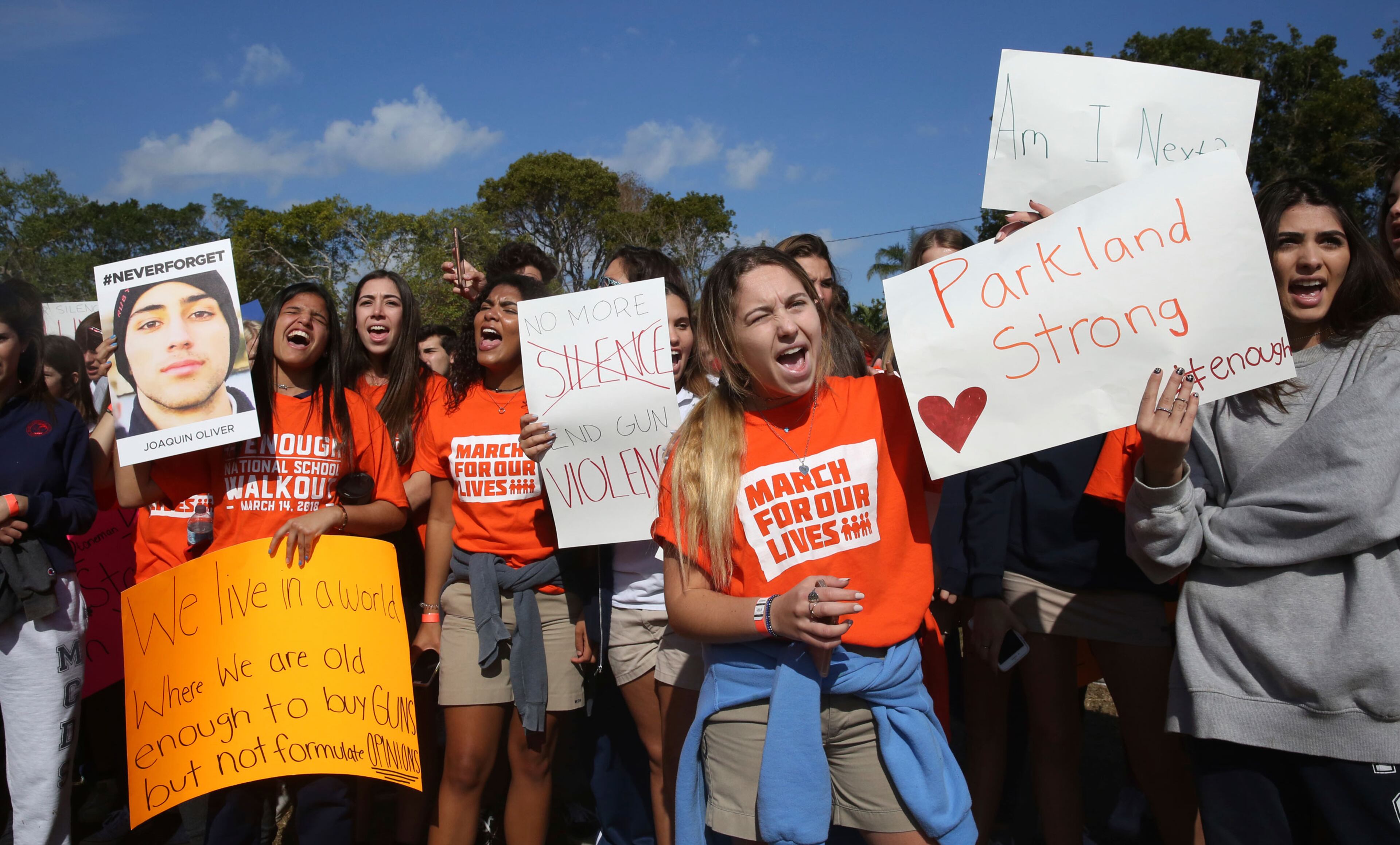 Students from Miami County Day School walk out of their school to protest gun violence in Miami Shores, Fla., Wednesday, March 14, 2018. Students from all over the country rallied to continue to put pressure on state and federal lawmakers to enact gun control and school safety legislation. The day marks one month since a gunman killed 17 students and faculty at Marjory Stoneman Douglas High School in Parkland, Fla.