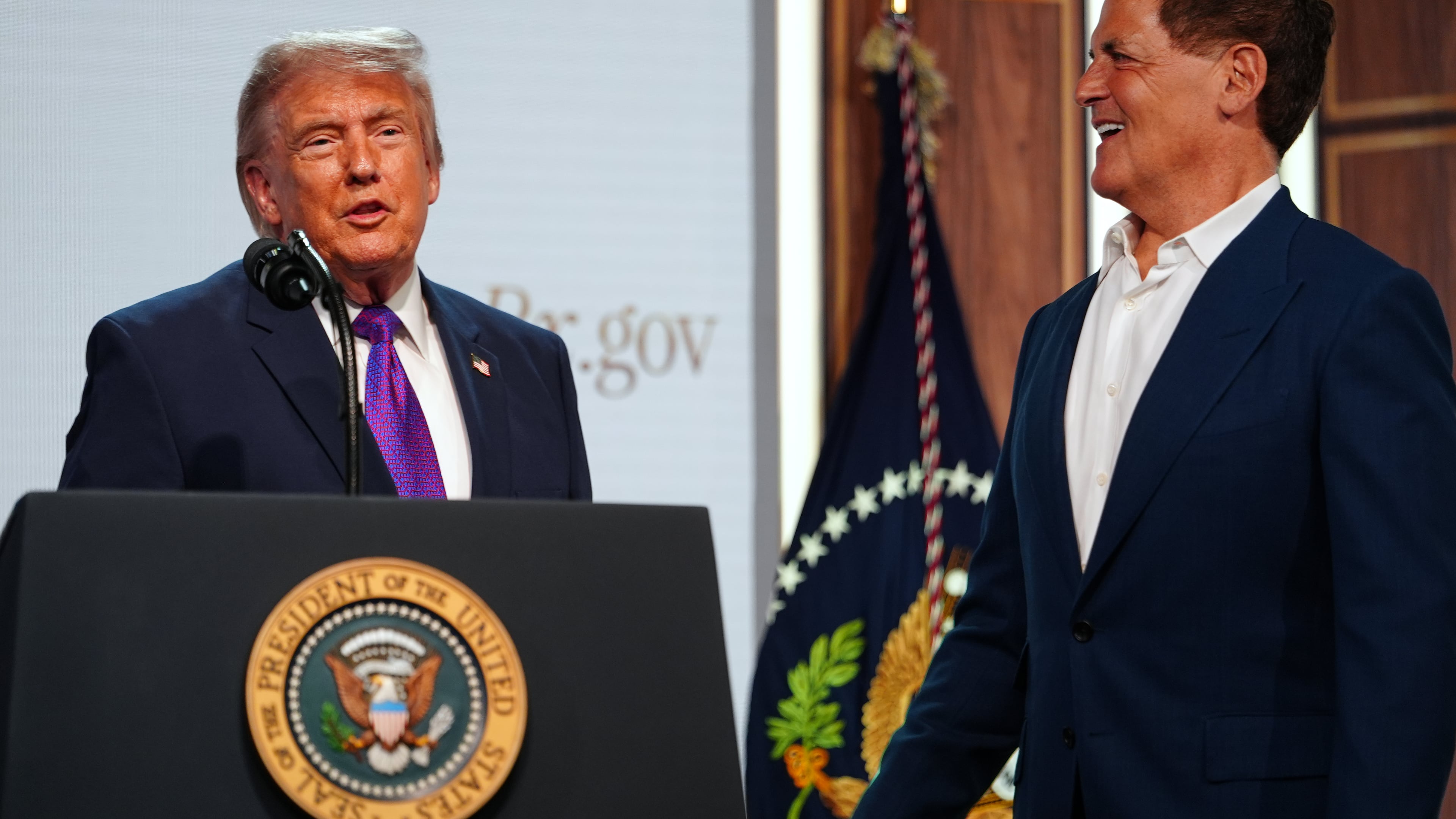 President Donald Trump shakes hands with Mark Cuban of Cost Plus Drugs, as he speaks about prescription drug prices in the South Court Auditorium in the Eisenhower Executive Office Building on the White House campus, Monday, May 18, 2026, in Washington. (AP Photo/Julia Demaree Nikhinson)