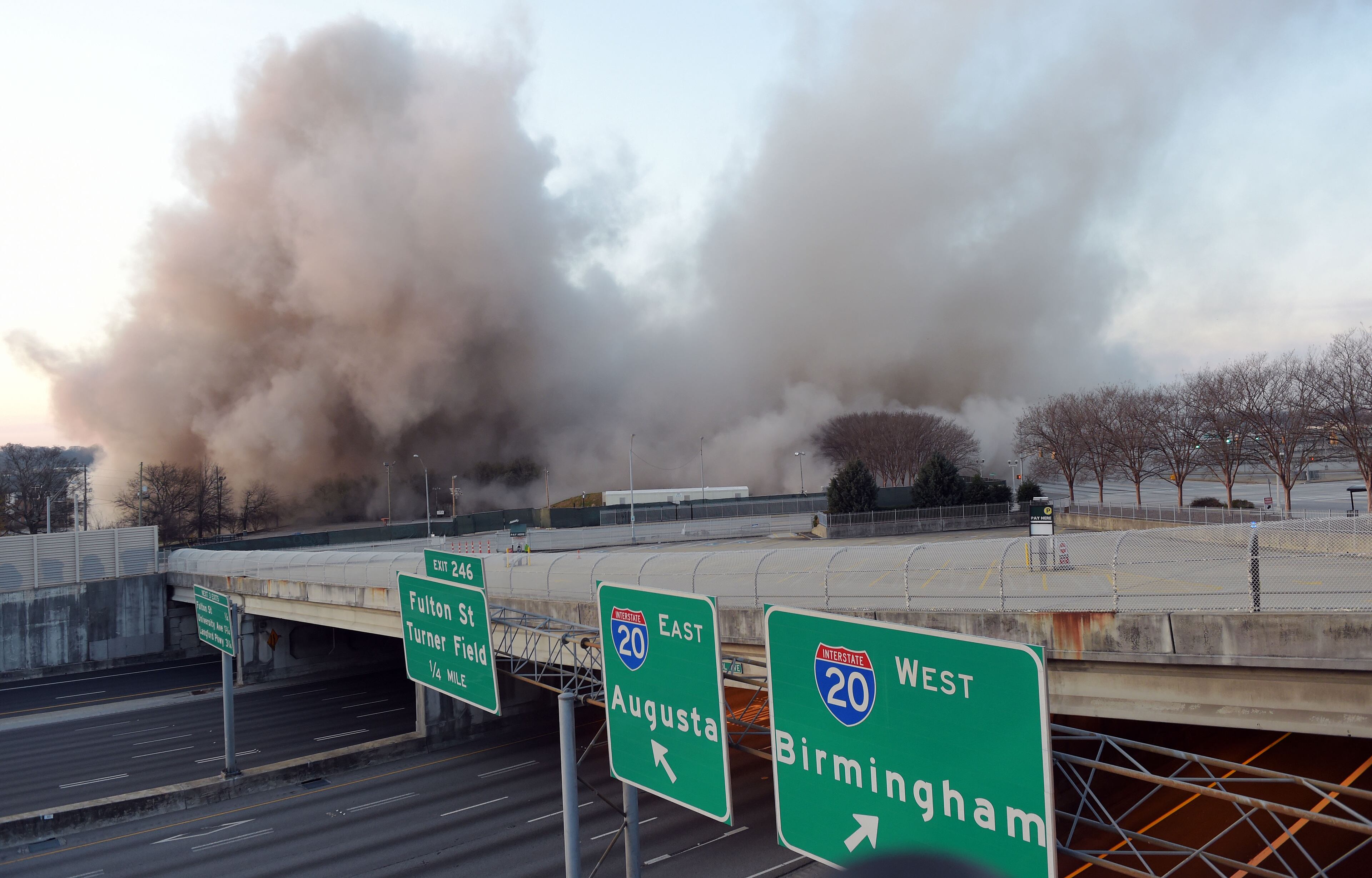 MARCH 5, 2017 7:06:01 AM ATLANTA A dust cloud rises after demolition crews brought down the old state archives building in a controlled implosion shortly after 7 am Sunday, March 5, 2017. The 14 story state archives building was about 50 years old and was imploded to make way for a new state courts building. Gov. Deal has budgeted about $105 million in next year's budget for the new state courts building. Kent D. Johnson/AJC