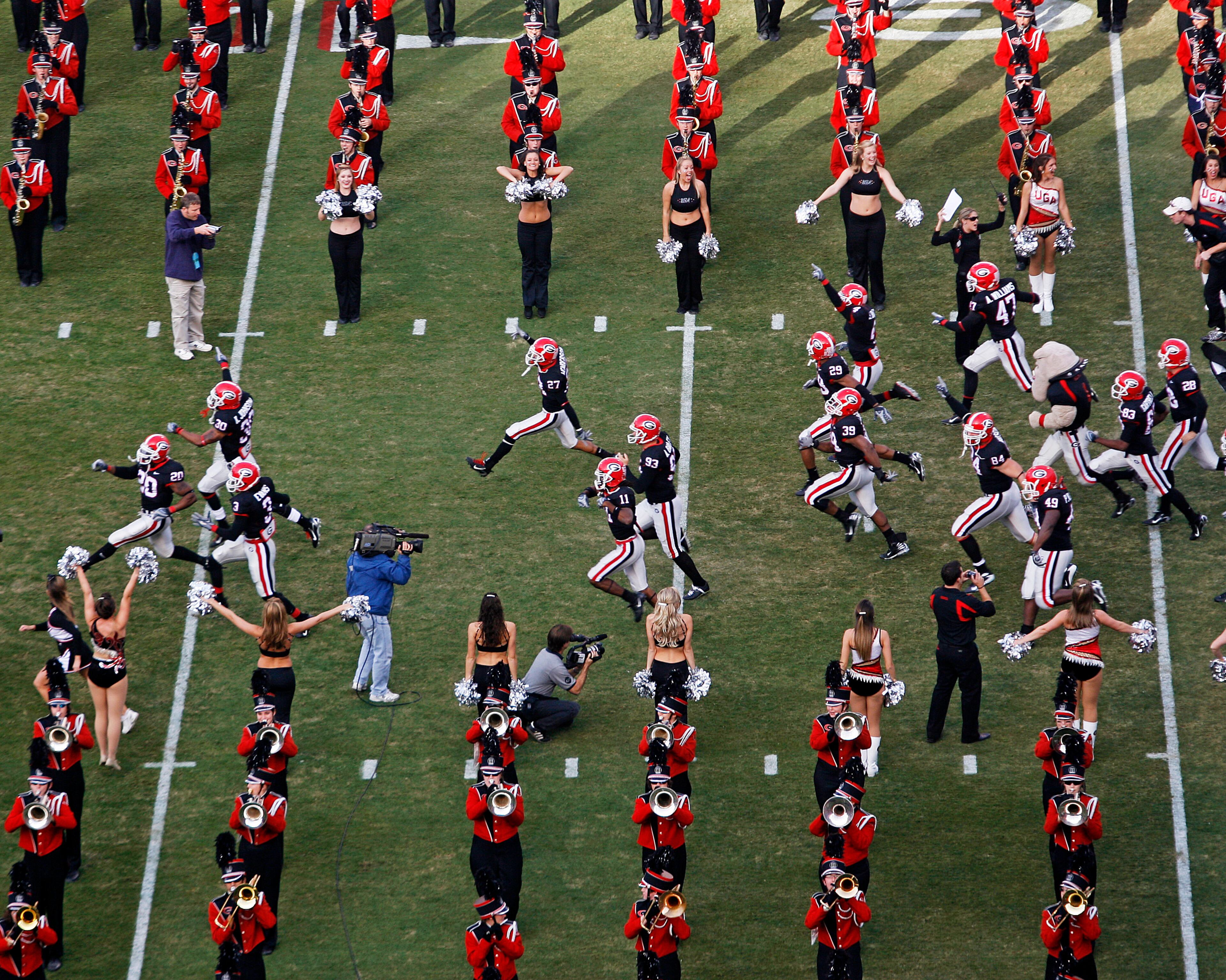 Georgia players burst onto the field for the 2007 home game against Auburn. Pouya Dianat / AJC
