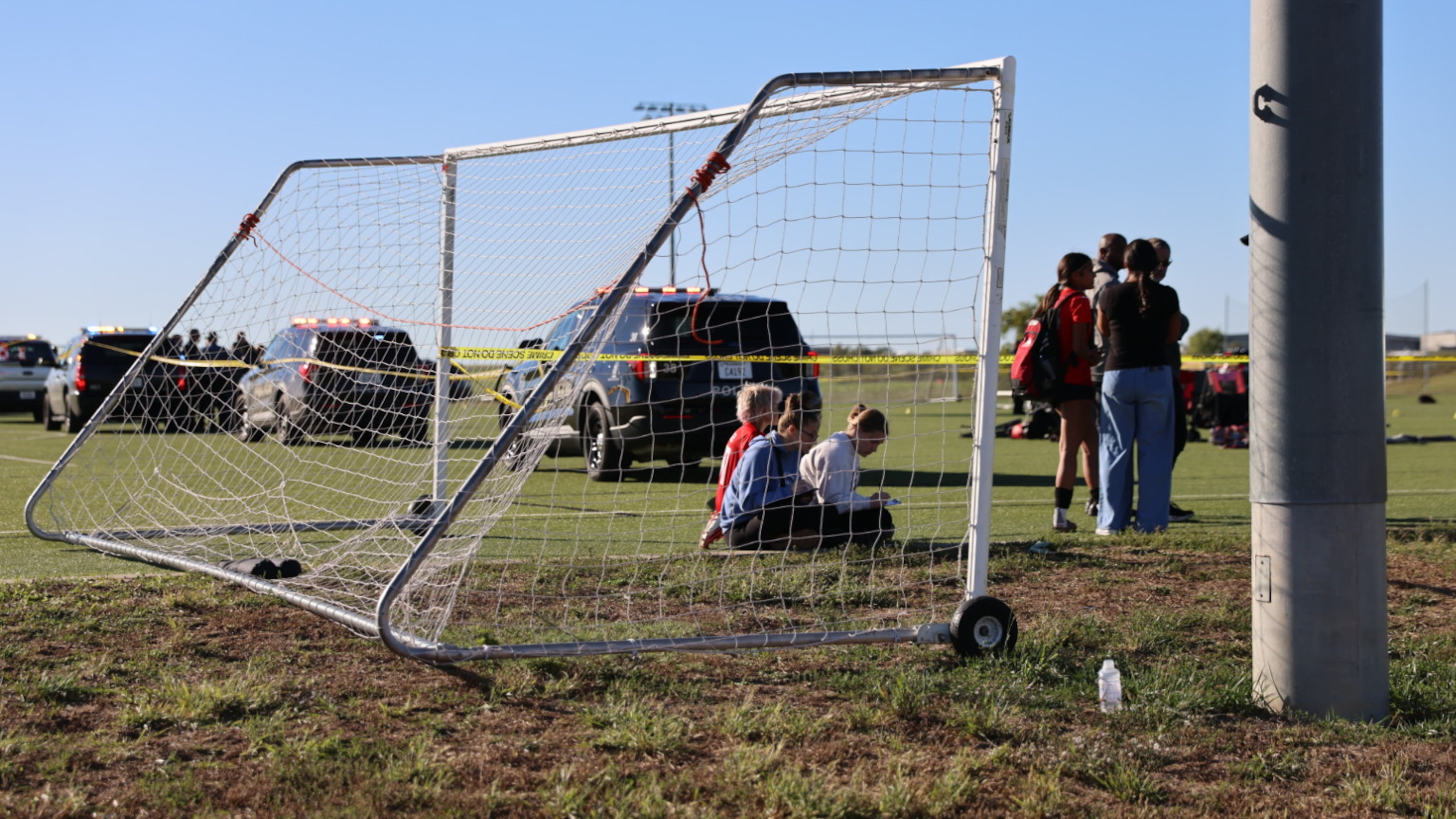 This image provided by KAKE shows police on the scene where a person drove a vehicle through a soccer field during a game in Wichita, Kansas, Saturday, Oct. 17, 2026. (Wyatt Glosson/KAKE via AP)