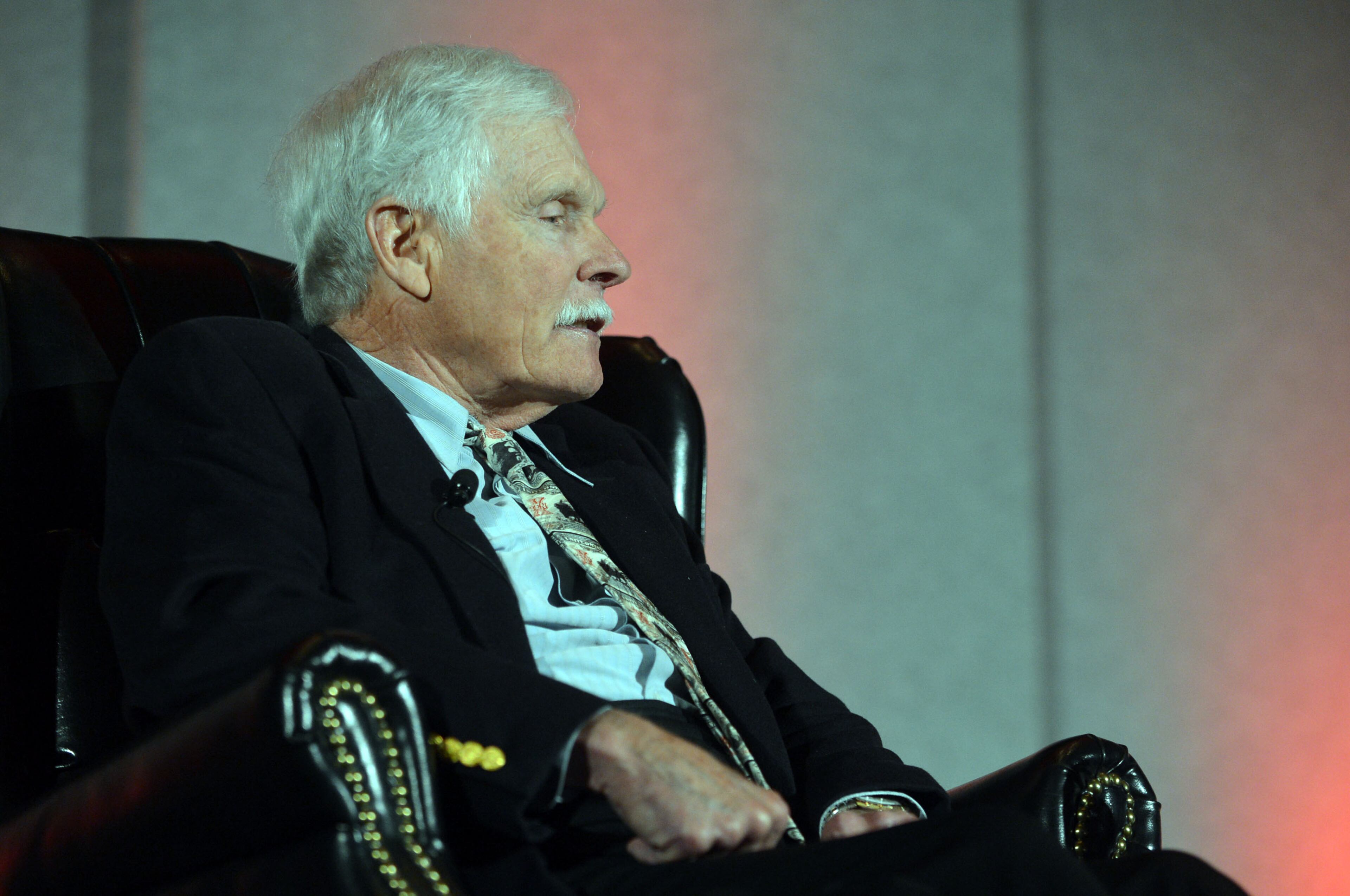 Ted Turner, back from hospitalization in South America, talks during the Technology Association of Georgia 2014 Technology Summit at the Cobb Galleria Centre Wednesday, March 26, 2014. Turner, the Atlanta billionaire and founder of Turner Broadcasting System, suffered from appendicitis while in the Patagonia region earlier this month. He underwent surgery at a hospital in Buenos Aires. On March 10, he thanked supporters and well-wishers, noting he was recuperating and “looking forward to getting back to business as usual.”