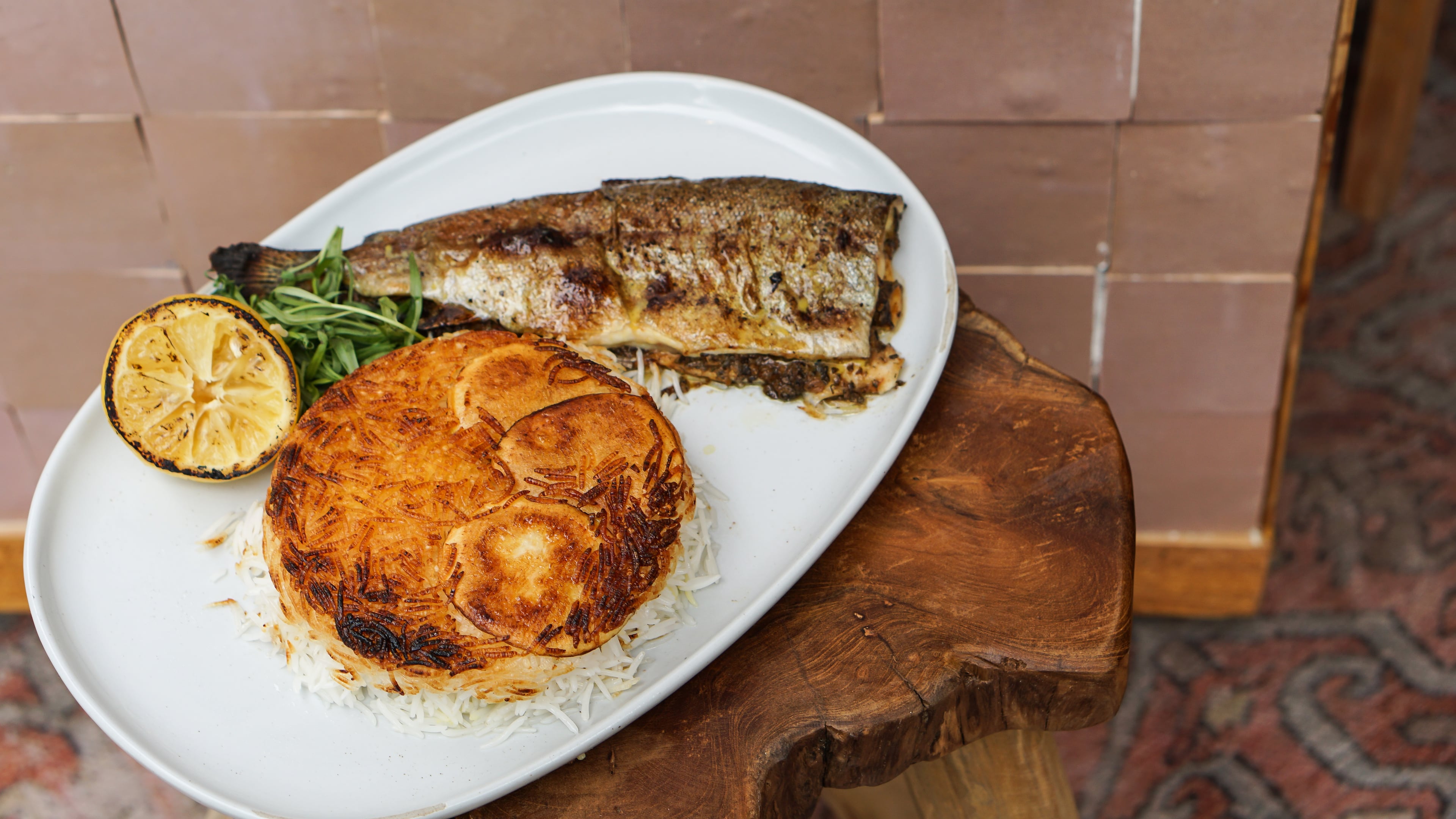 Delbar’s Walnut and Pomegranate Stuffed Trout with Polo Sefid
Courtesy of Fares Kargar