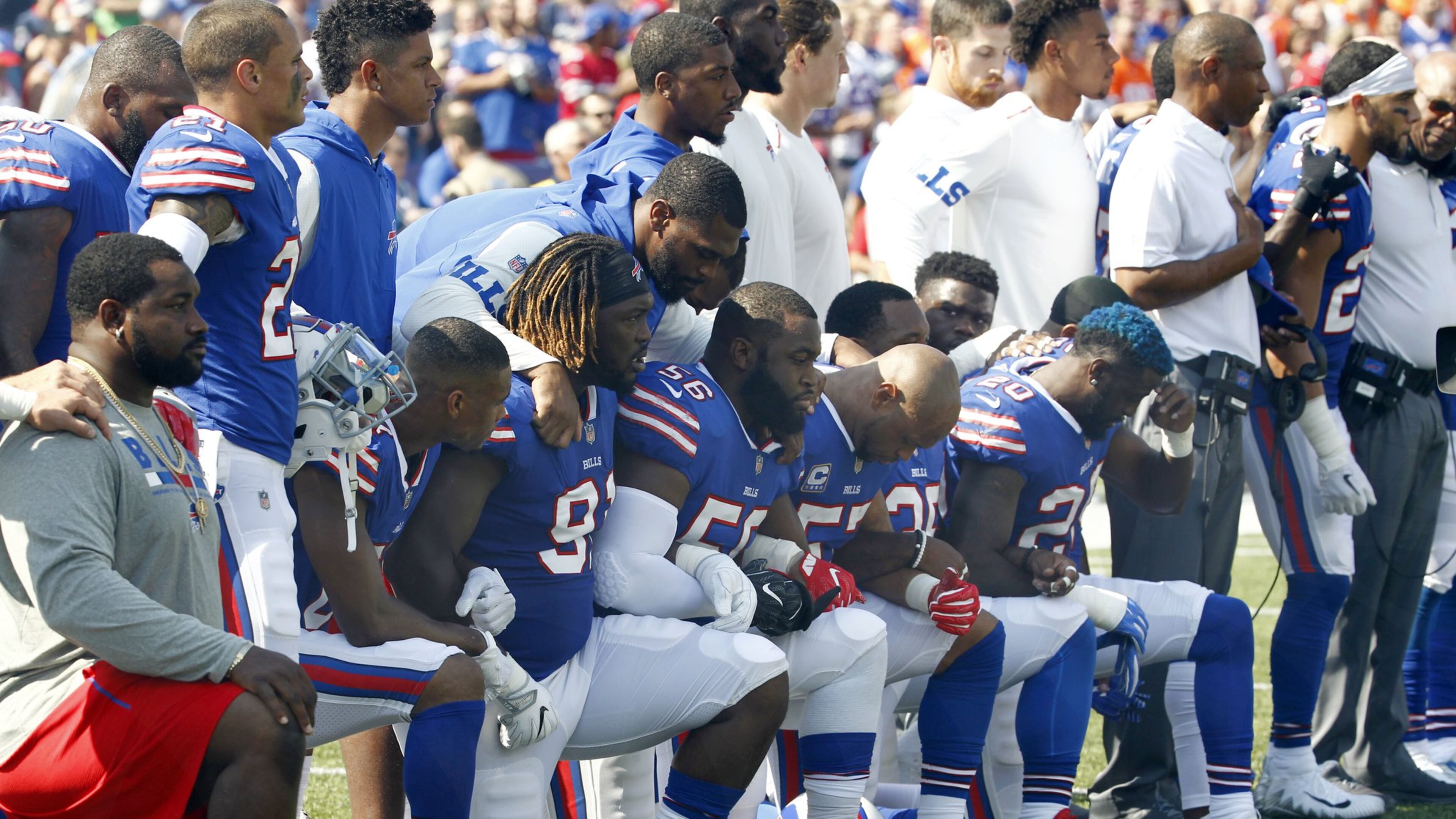 In this Sunday, Sept. 24, 2017, file photo, Buffalo Bills players take a knee during the playing of the national anthem before a home game against the Denver Broncos. President Trump said such protests are part of the reason NFL ratings and attendance are down. (AP Photo/Jeffrey T. Barnes, File)