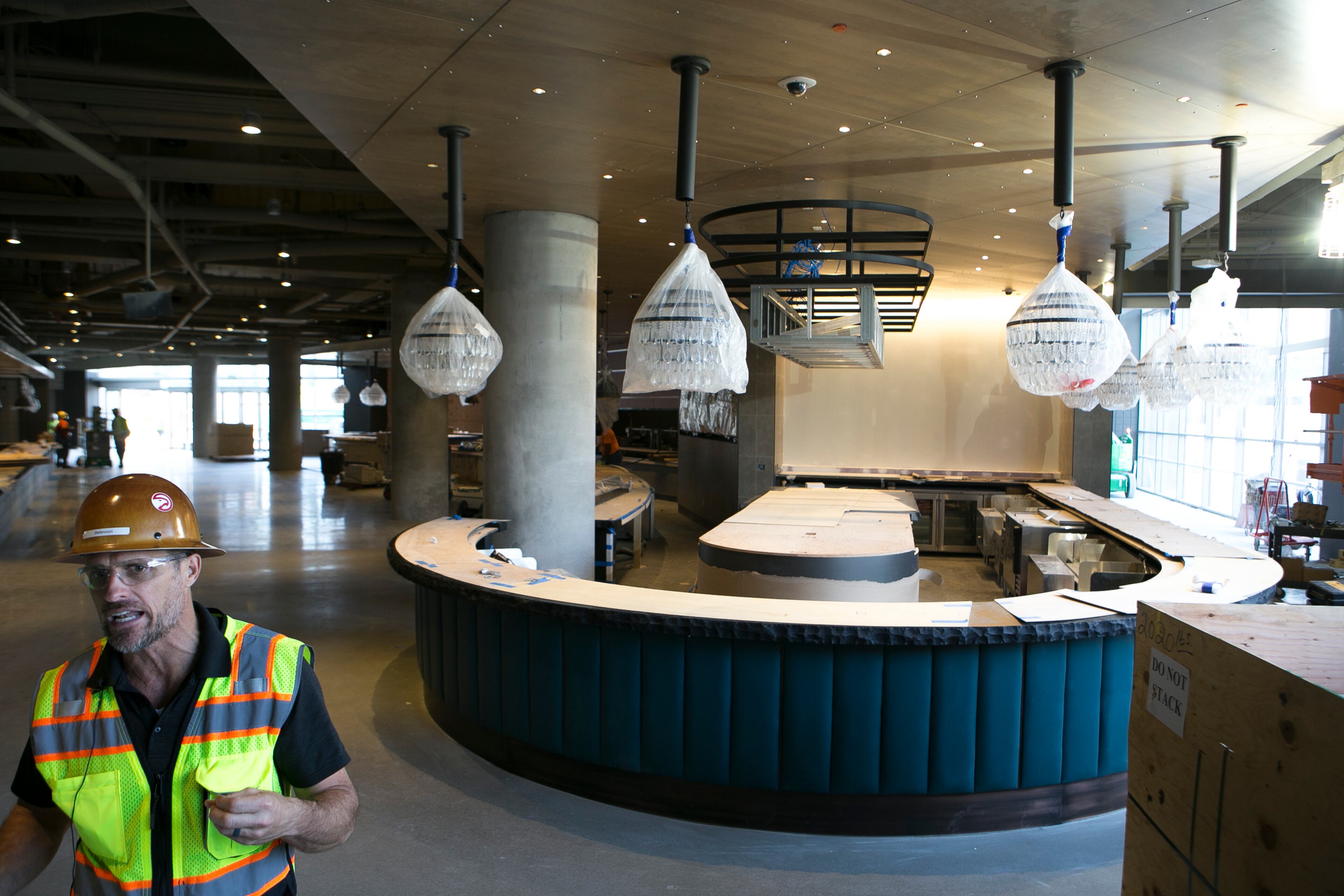 Brett Stefansson, Atlanta Hawks executive vice president and general manager of State Farm Arena, speaks to members of the media in front of the Zac Brown Social Club area during a guided media tour through the in-progress renovations at the State Farm Arena in Atlanta, Ga., on Thurs., Sept. 20, 2018. The renovations, which total $192.5 million, are on track to be completed by the arena's scheduled open house on October 20. The current rate of progress is about $1 million of work per day, according to Stefansson. (CASEY SYKES, CASEYLANESYKES@GMAIL.COM)
